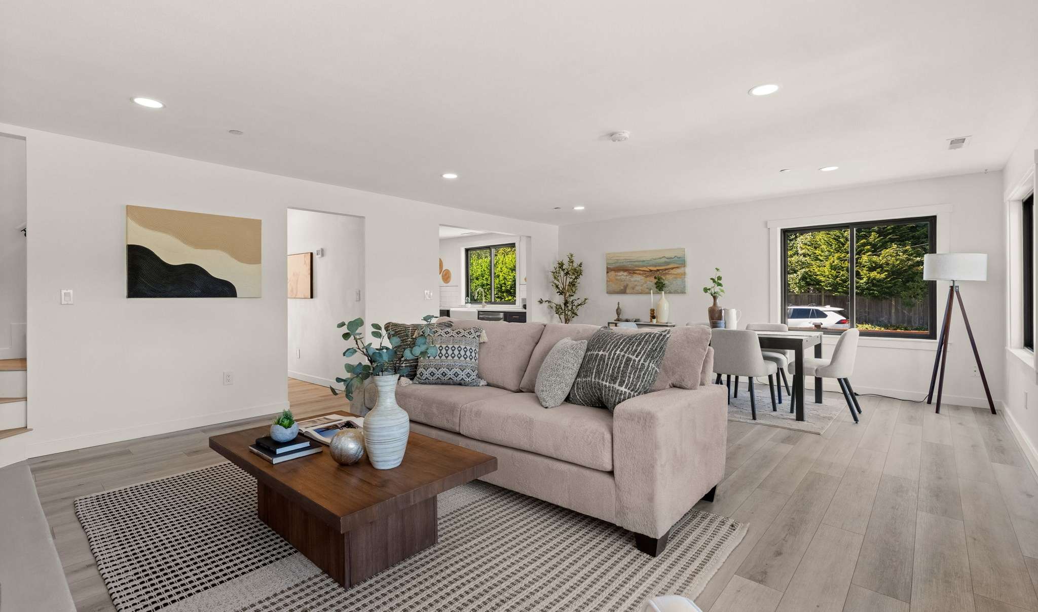 6 of 33. Spacious dining area and living room - perfect for entertaining (directly off of your open kitchen)