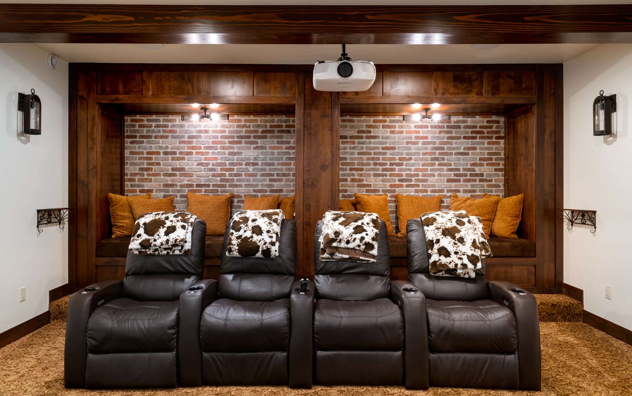 29 of 42. Discover a cozy home theater featuring comfortable seating, unique decor, and inviting niche seating.