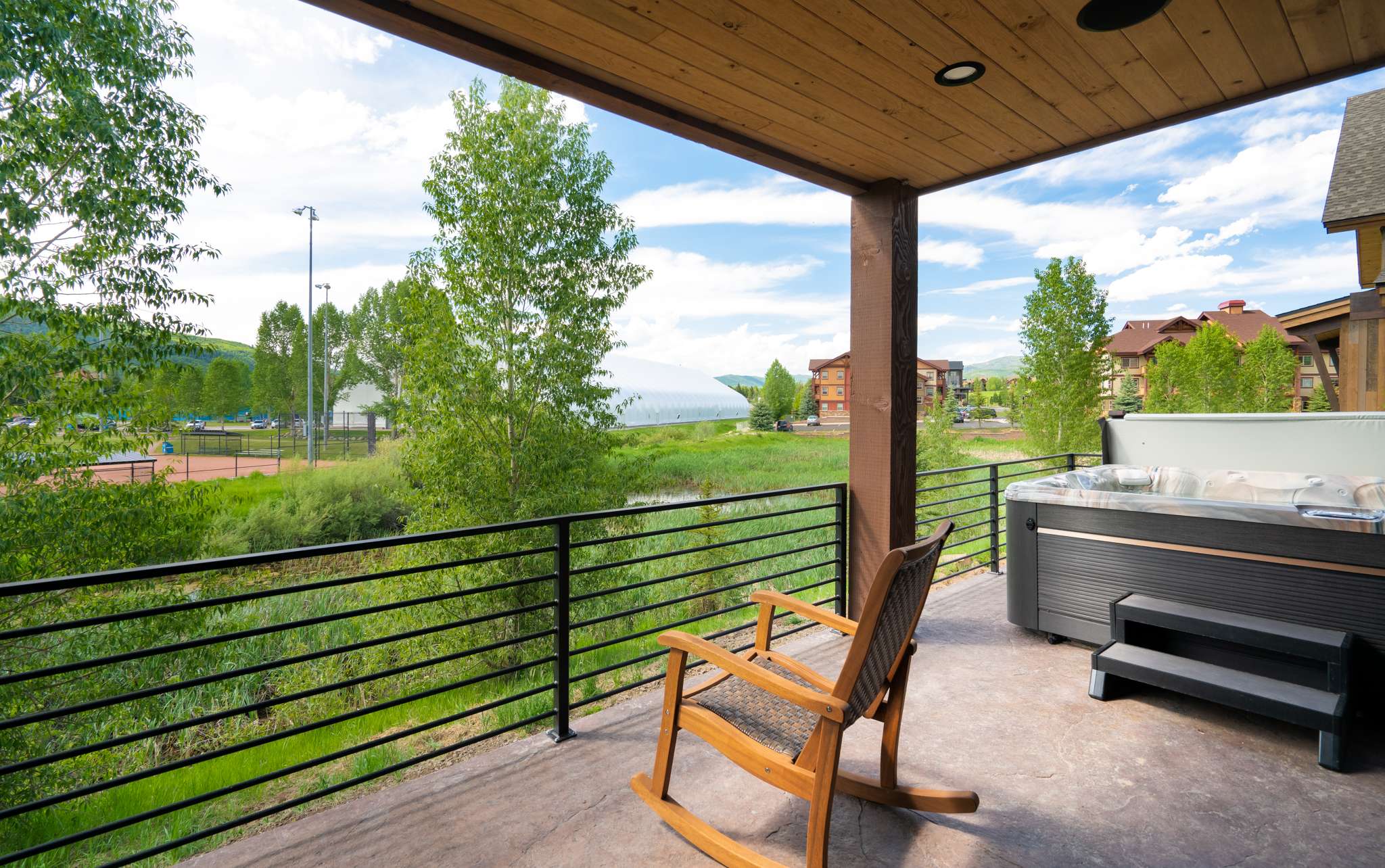 33 of 42. Enjoy stunning views and peaceful surroundings from this inviting outdoor deck with a hot tub.