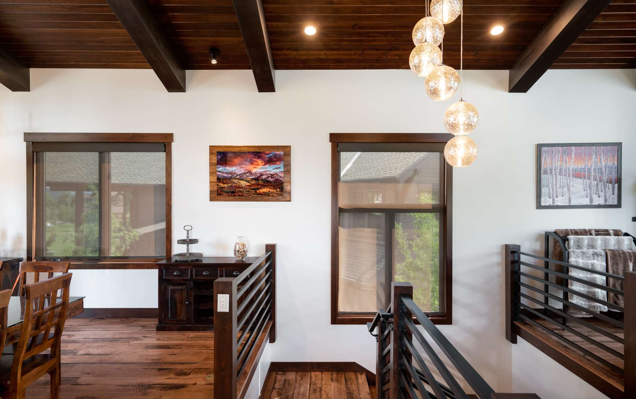 4 of 42. The upper level features wood accents, modern light fixtures, and large windows that invite natural light.