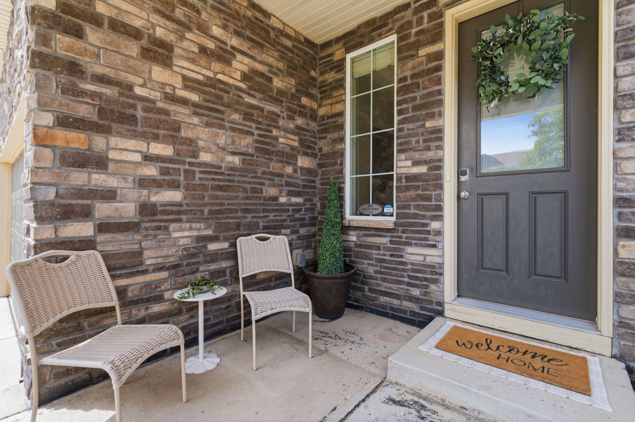 3 of 34. Enjoy a cozy covered porch for welcoming friends.
