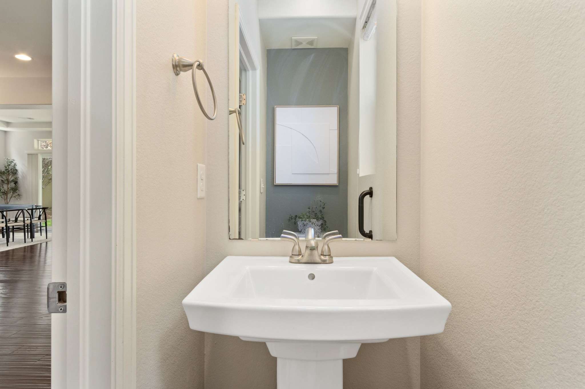 27 of 34. A powder bath is located at the entry of the home.