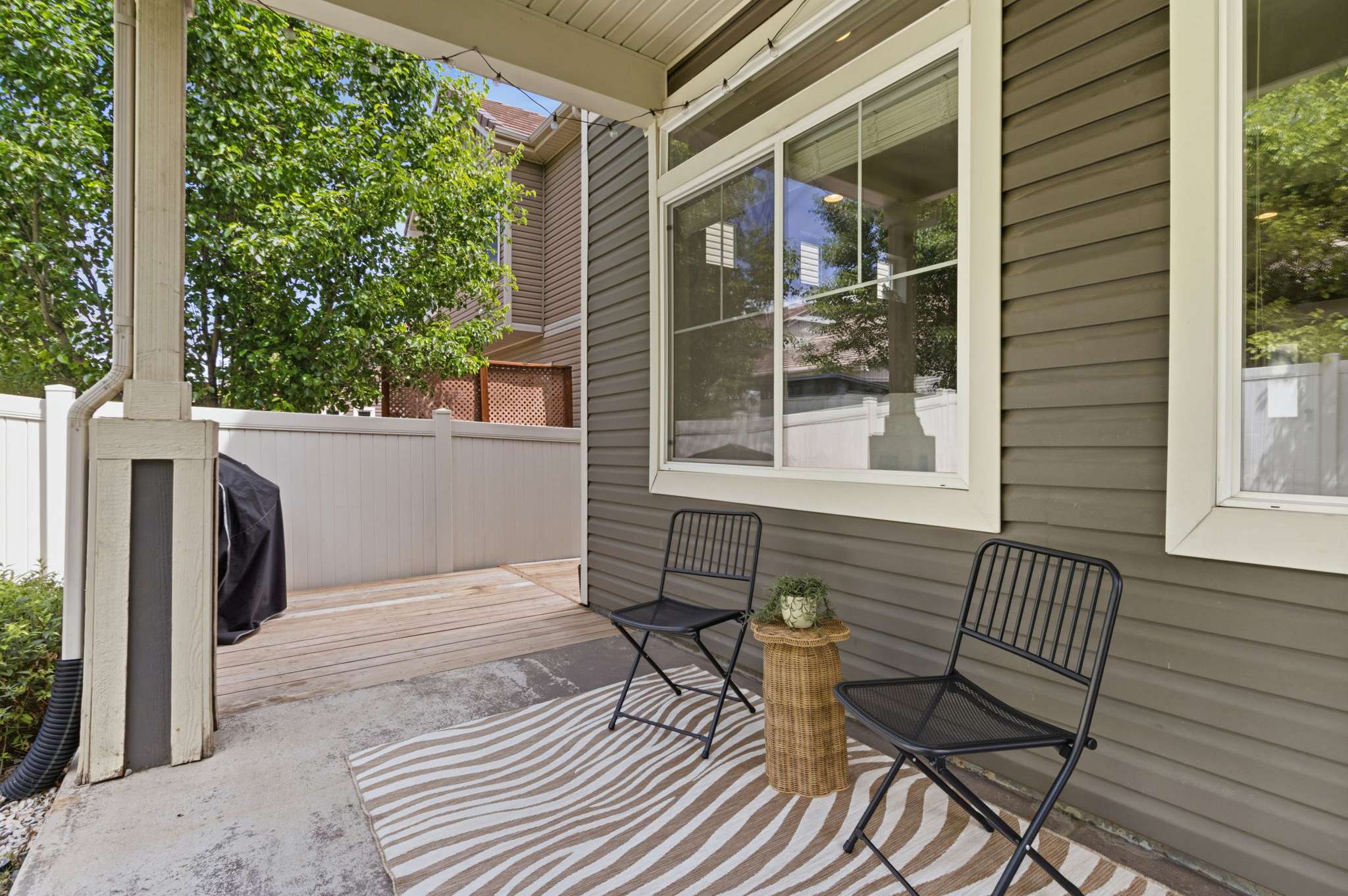 29 of 34. A cozy covered patio calls for summer barbecues and hanging out with friends!