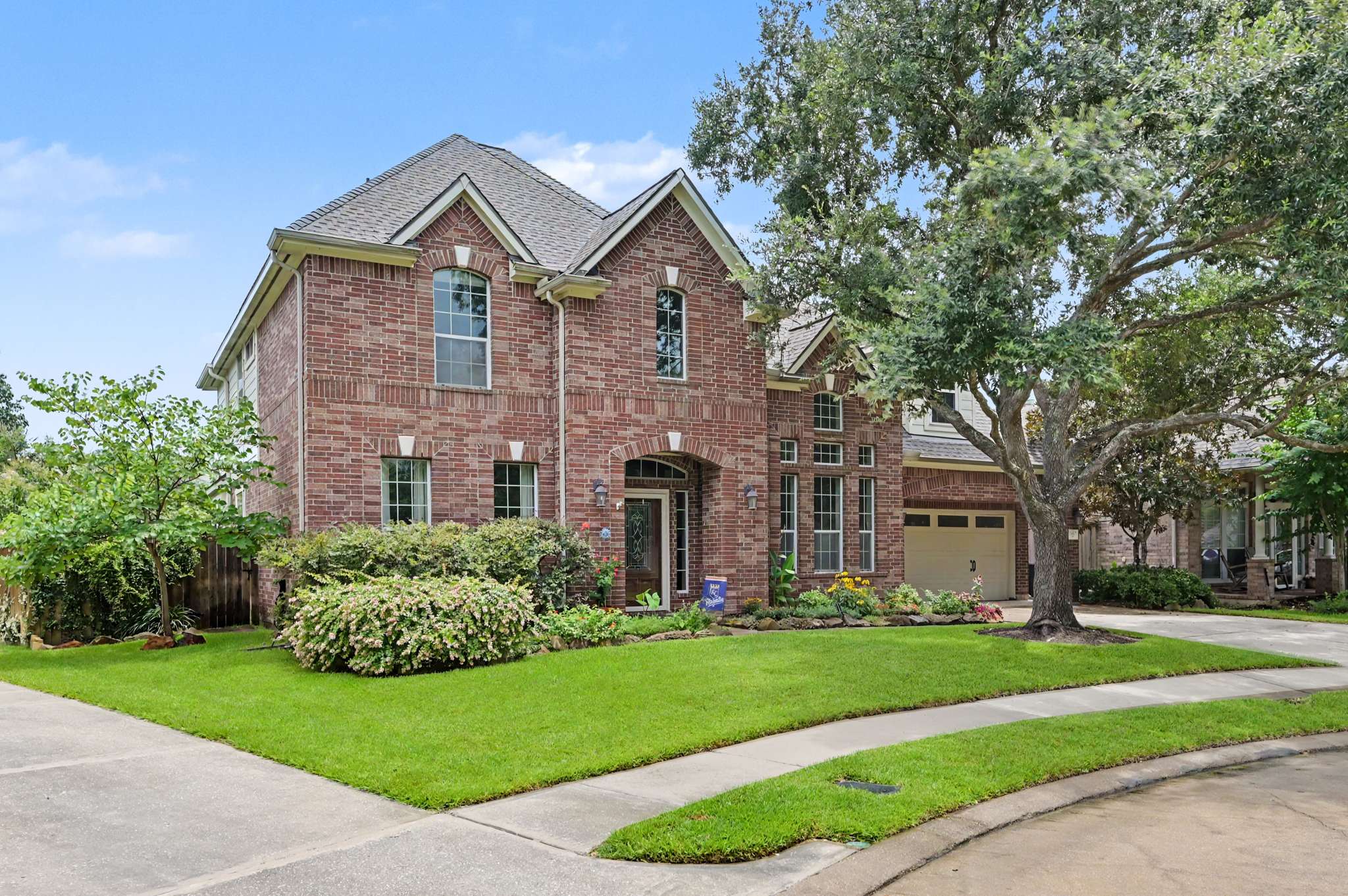 14 of 71. This spacious brick home features a beautifully landscaped yard and welcoming curb appeal, ideal for family living.