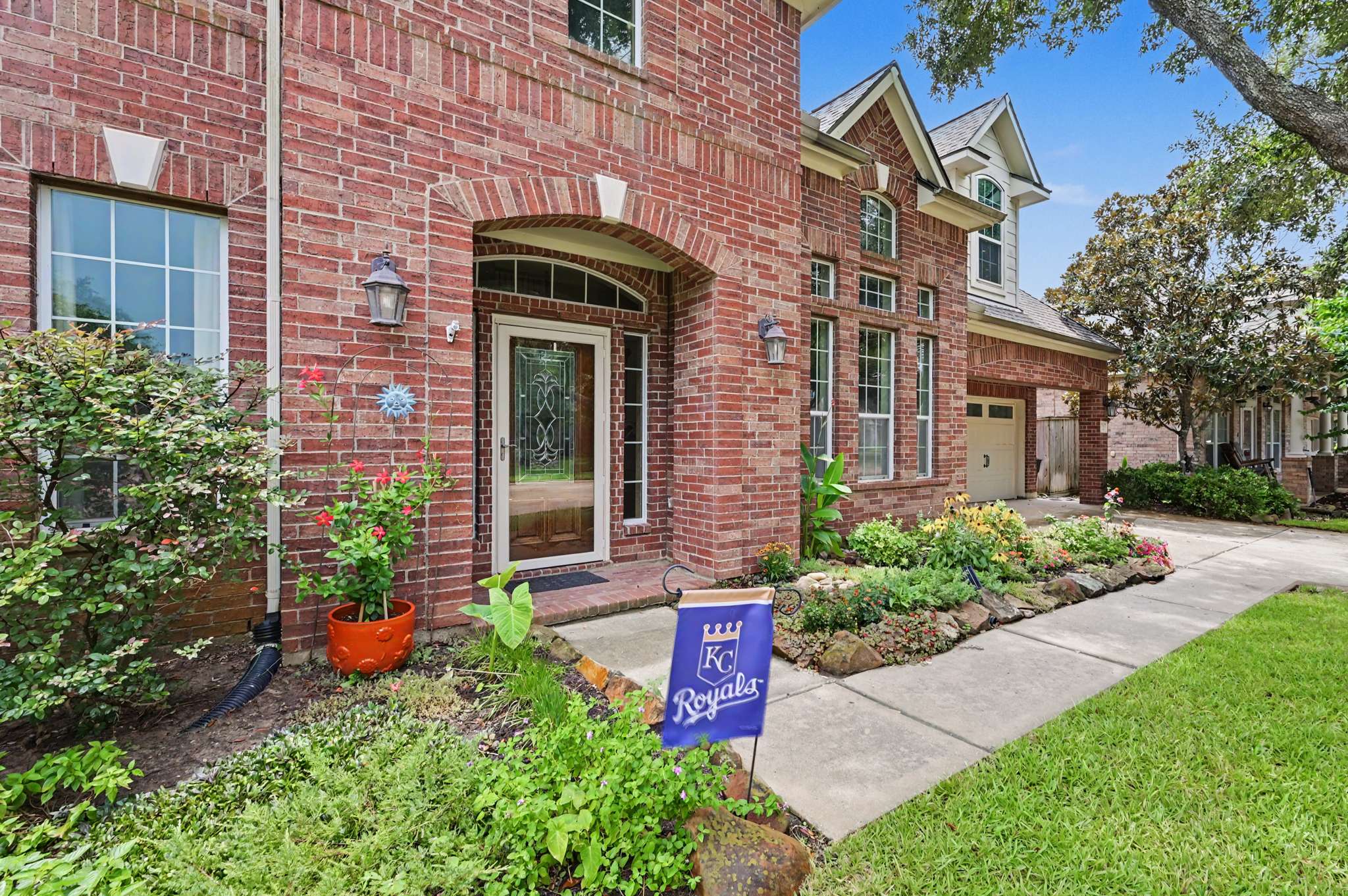 17 of 71. Beautifully landscaped entryway welcomes you to this spacious brick home, featuring ample natural light and modern design.