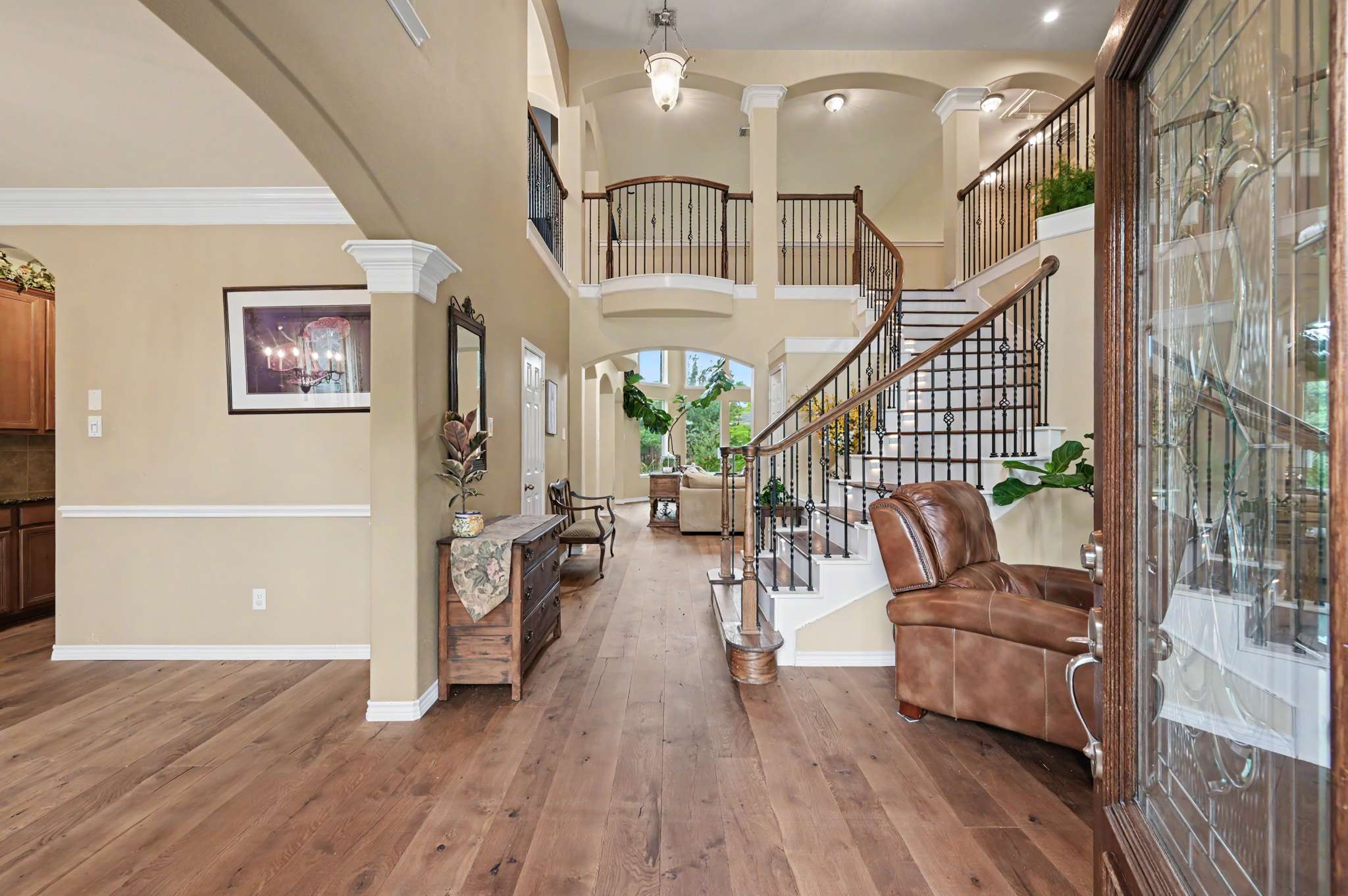 6 of 71. Spacious entryway features a dual staircase and open layout, perfect for welcoming gatherings and family activities.