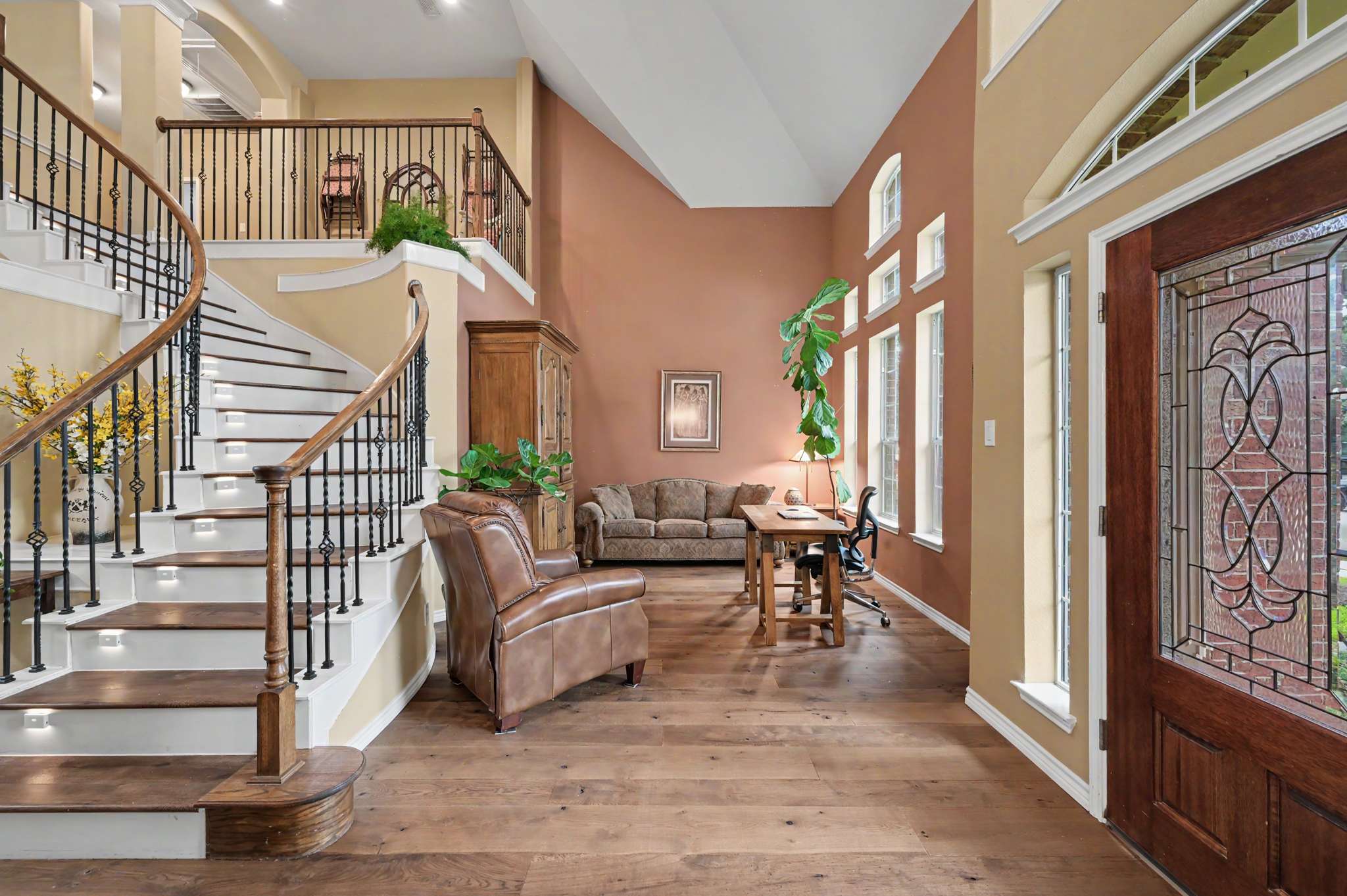19 of 71. Welcoming entryway with spacious layout, featuring grand staircase and abundant natural light throughout.