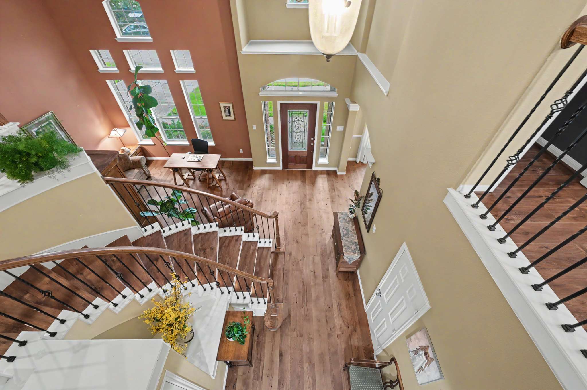3 of 71. Breathtaking foyer with sweeping staircase and abundant natural light creates an inviting entrance to your new home.