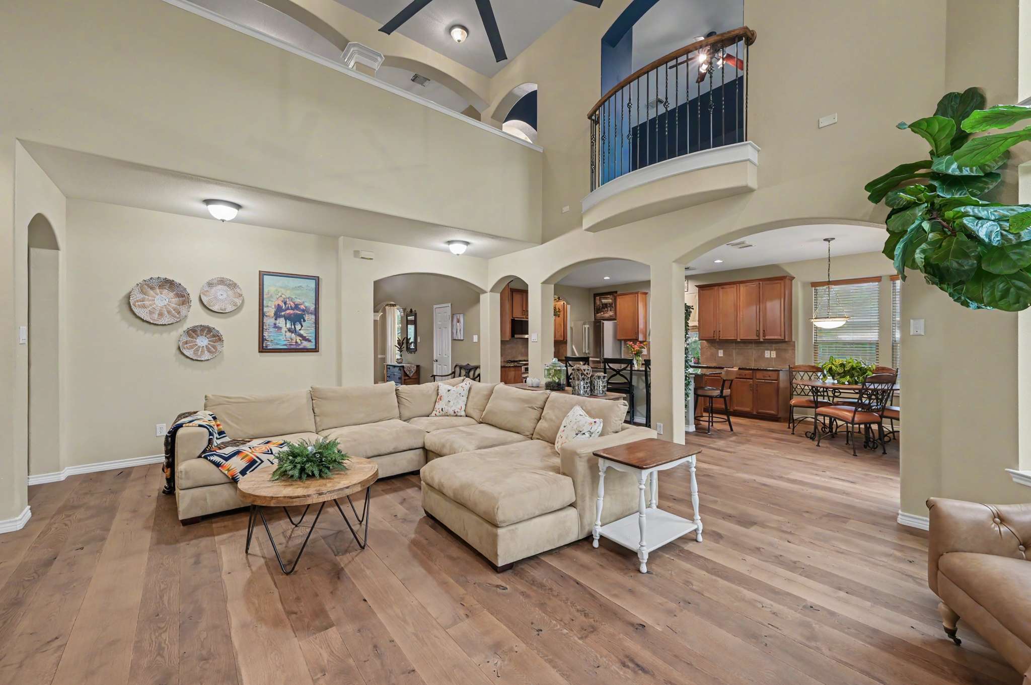 27 of 71. Spacious open living area features high ceilings, modern finishes, and a seamless flow to the kitchen.