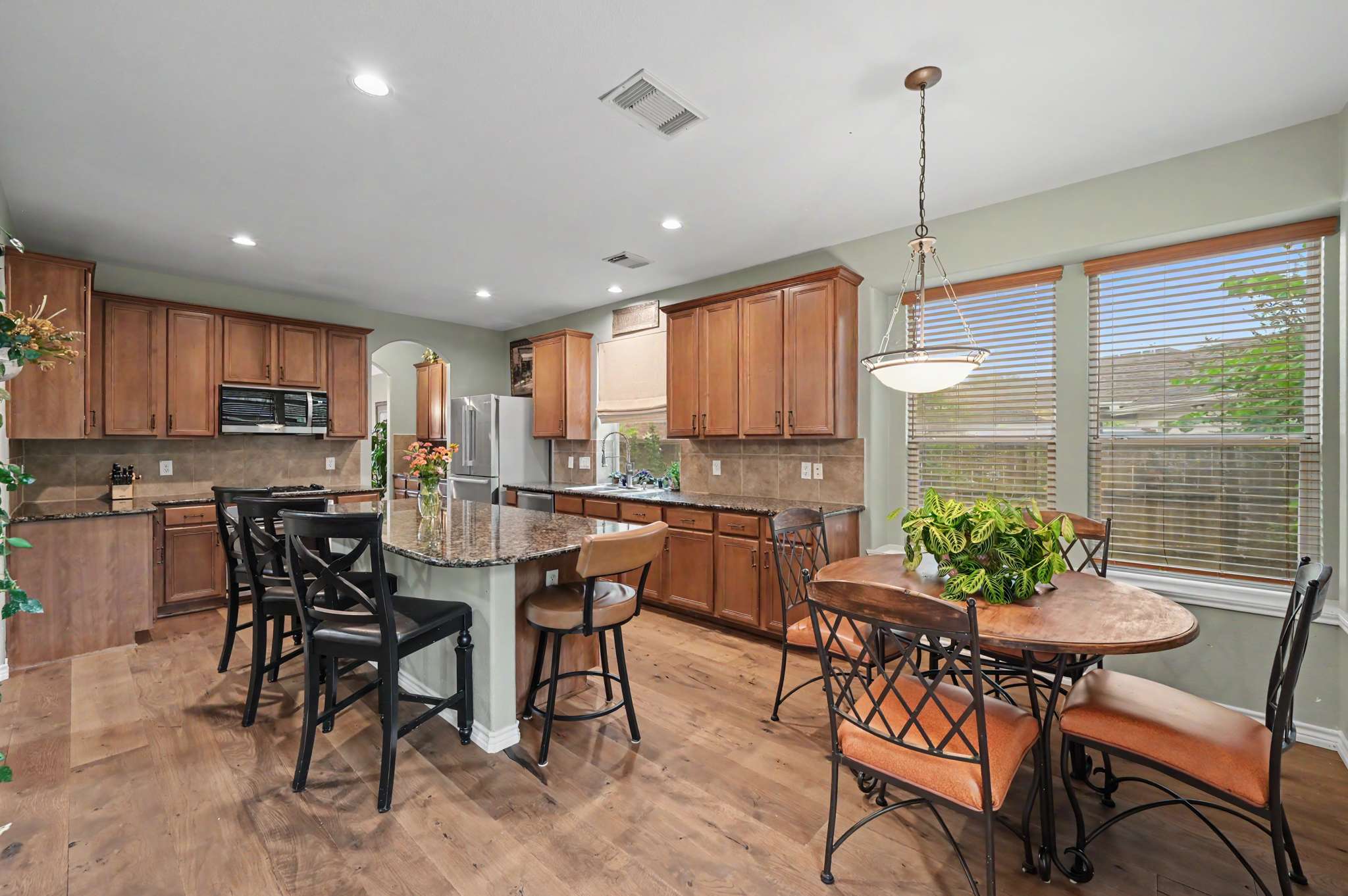 29 of 71. Spacious kitchen with modern appliances, ample counter space, and a cozy breakfast nook for casual dining.