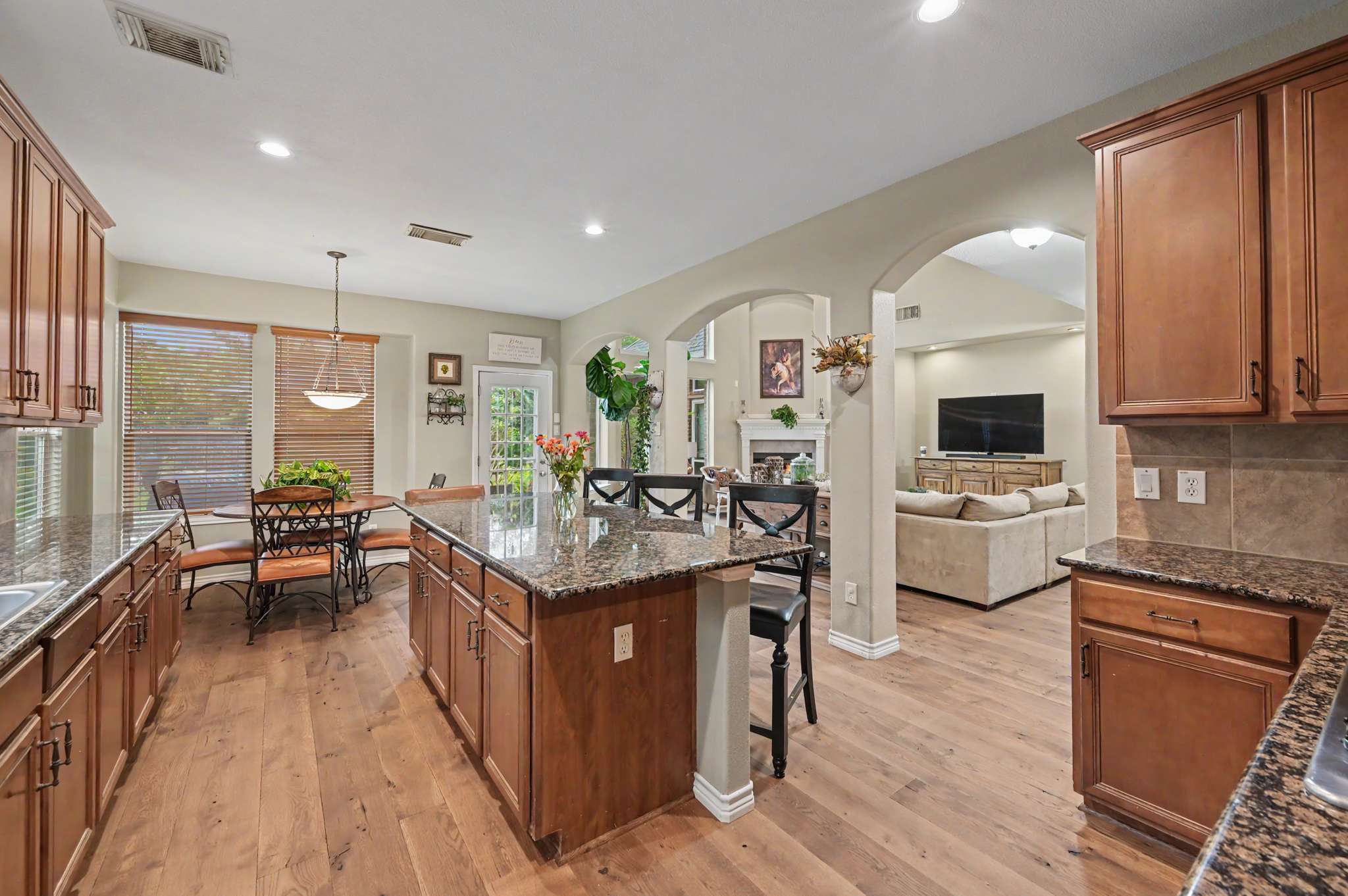 32 of 71. Spacious open-concept kitchen features modern appliances, abundant cabinetry, and connects seamlessly to the inviting dining area.