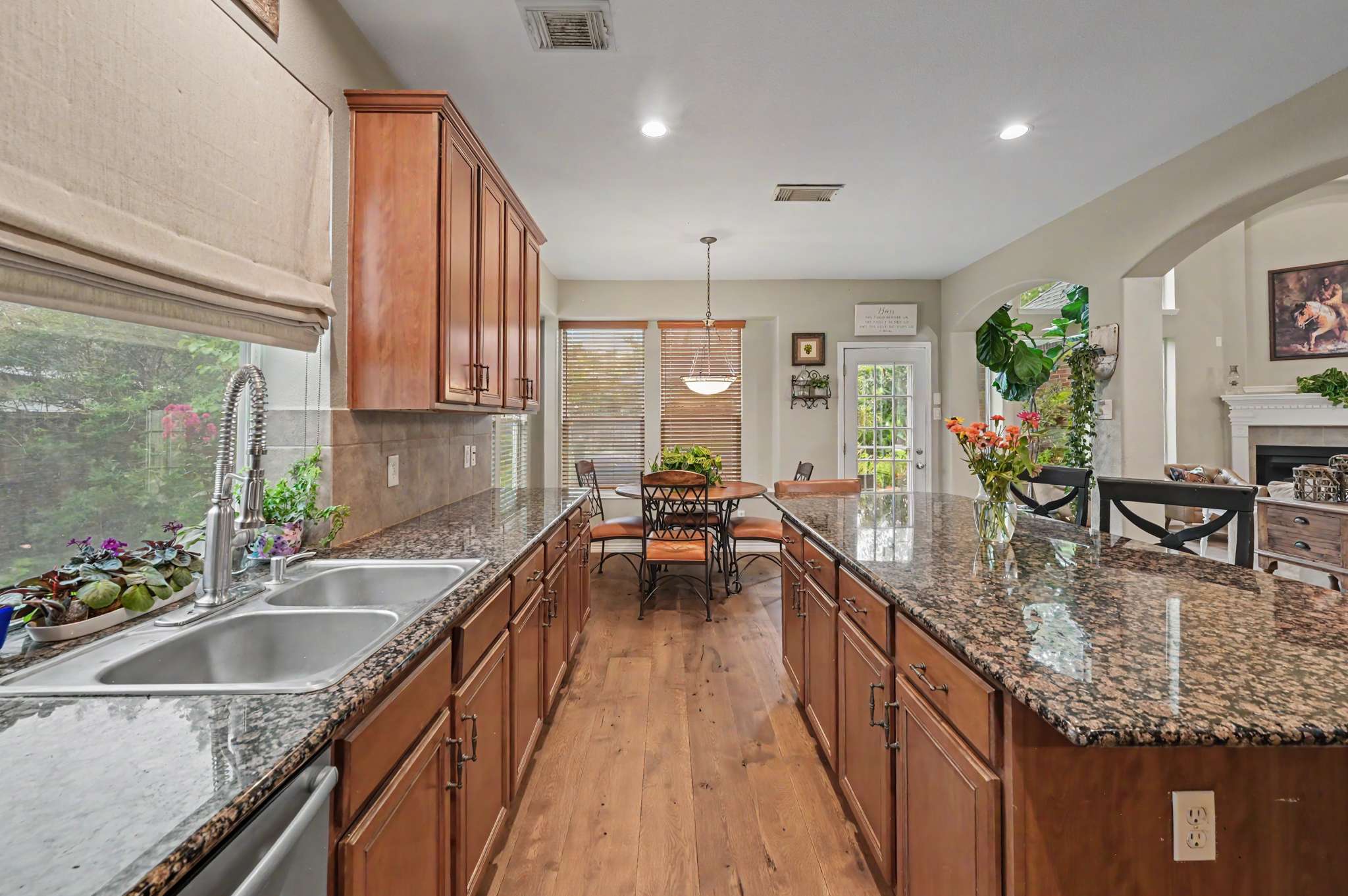 34 of 71. Bright and spacious open-concept kitchen featuring modern finishes and ample natural light throughout.