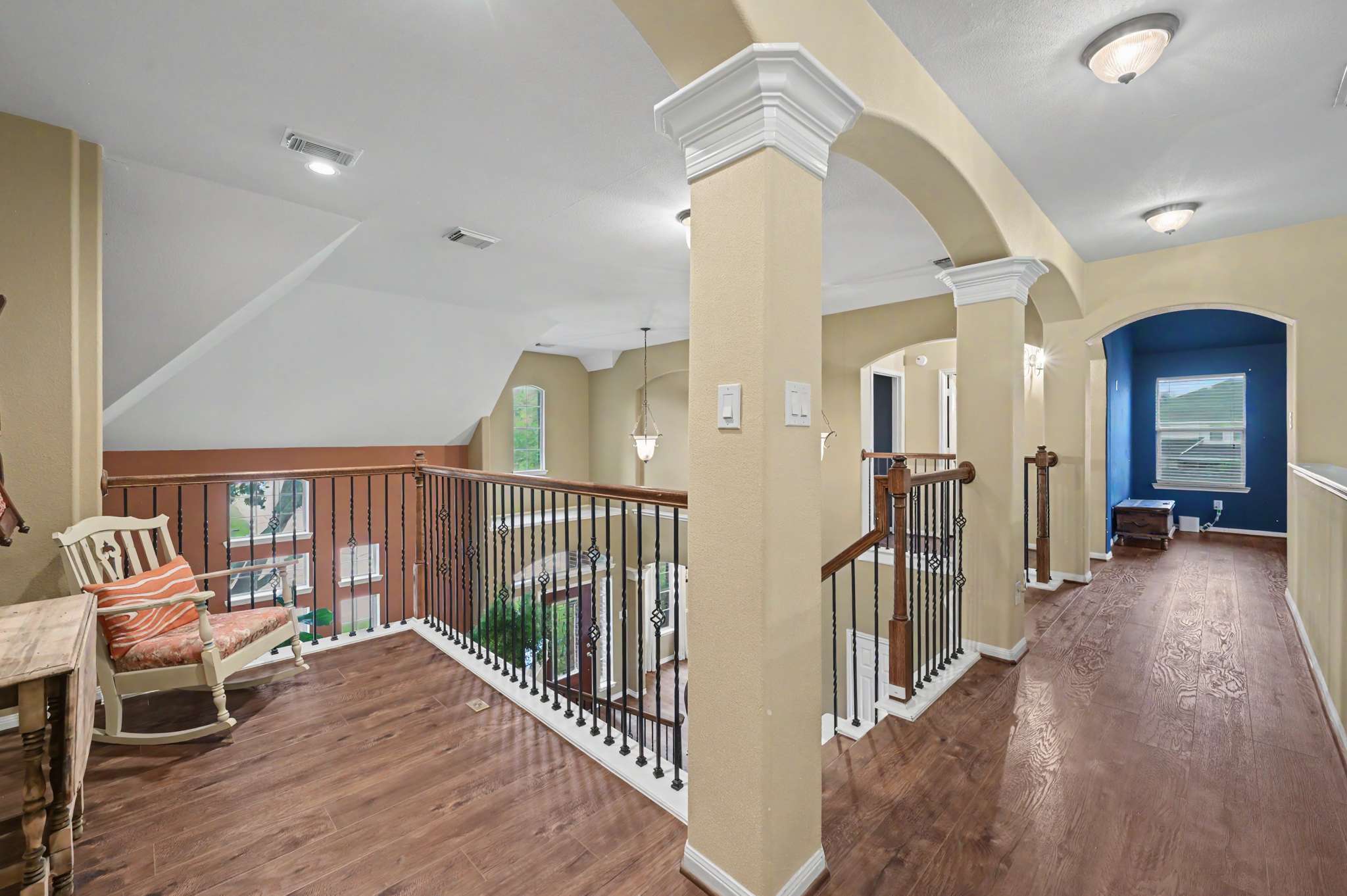 42 of 71. Spacious hallway features attractive architecture and natural light, connecting various living areas throughout the home.