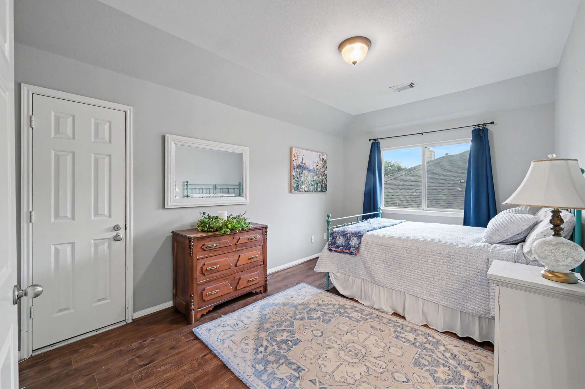 43 of 71. Bright and inviting bedroom featuring large windows, modern decor, and ample natural light throughout.