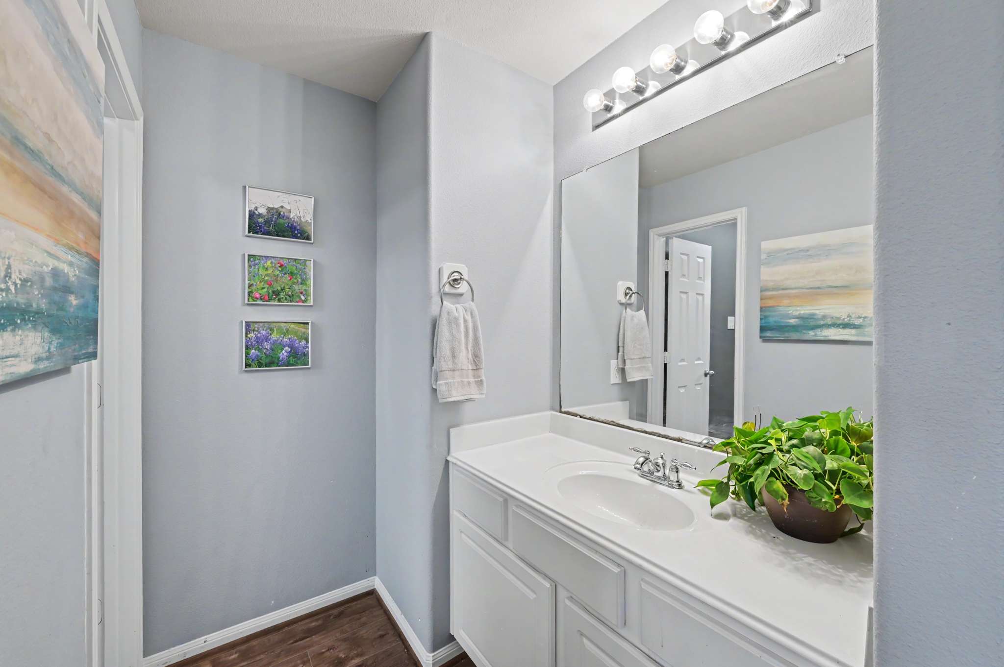 45 of 71. Bright and inviting bathroom featuring contemporary decor, ample counter space, and modern lighting for a refreshing ambiance.