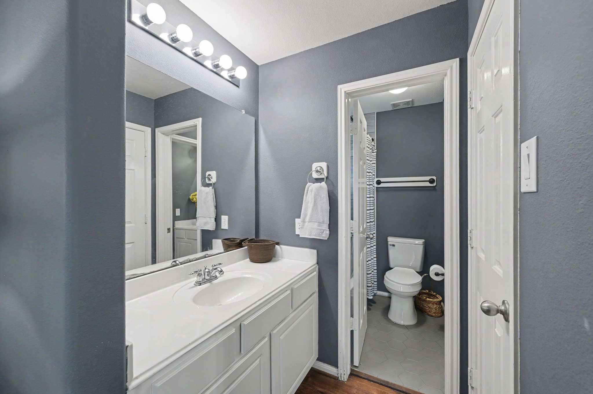 58 of 71. Modern bathroom featuring a spacious vanity, ample lighting, and convenient layout for everyday use.