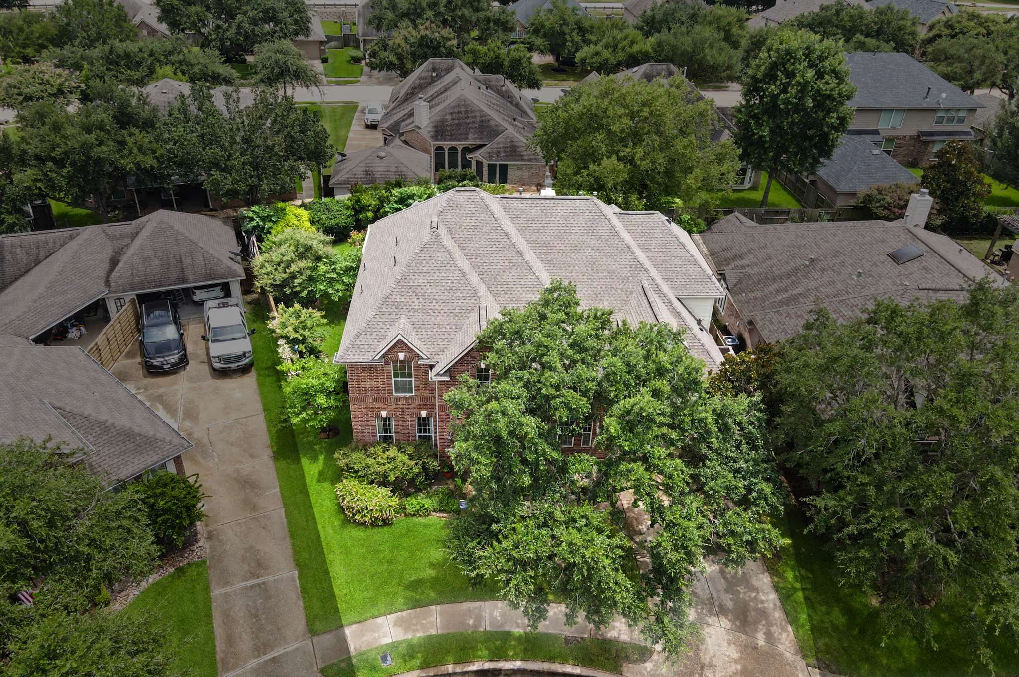 62 of 71. Spacious home nestled in a lush neighborhood, featuring an expansive yard and convenient two-car garage.