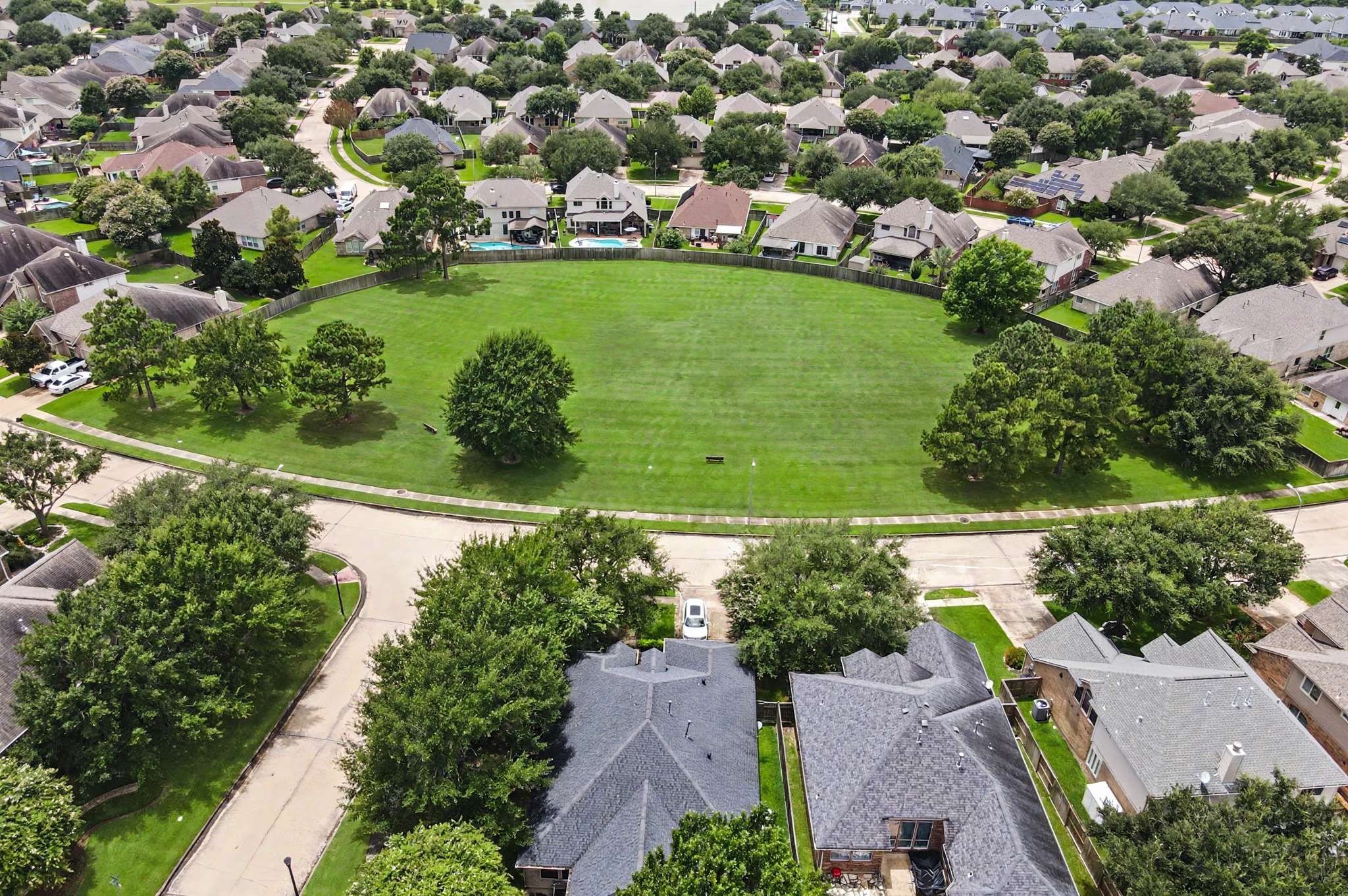 68 of 71. Spacious homes surround a central green space, ideal for outdoor activities and community gatherings.