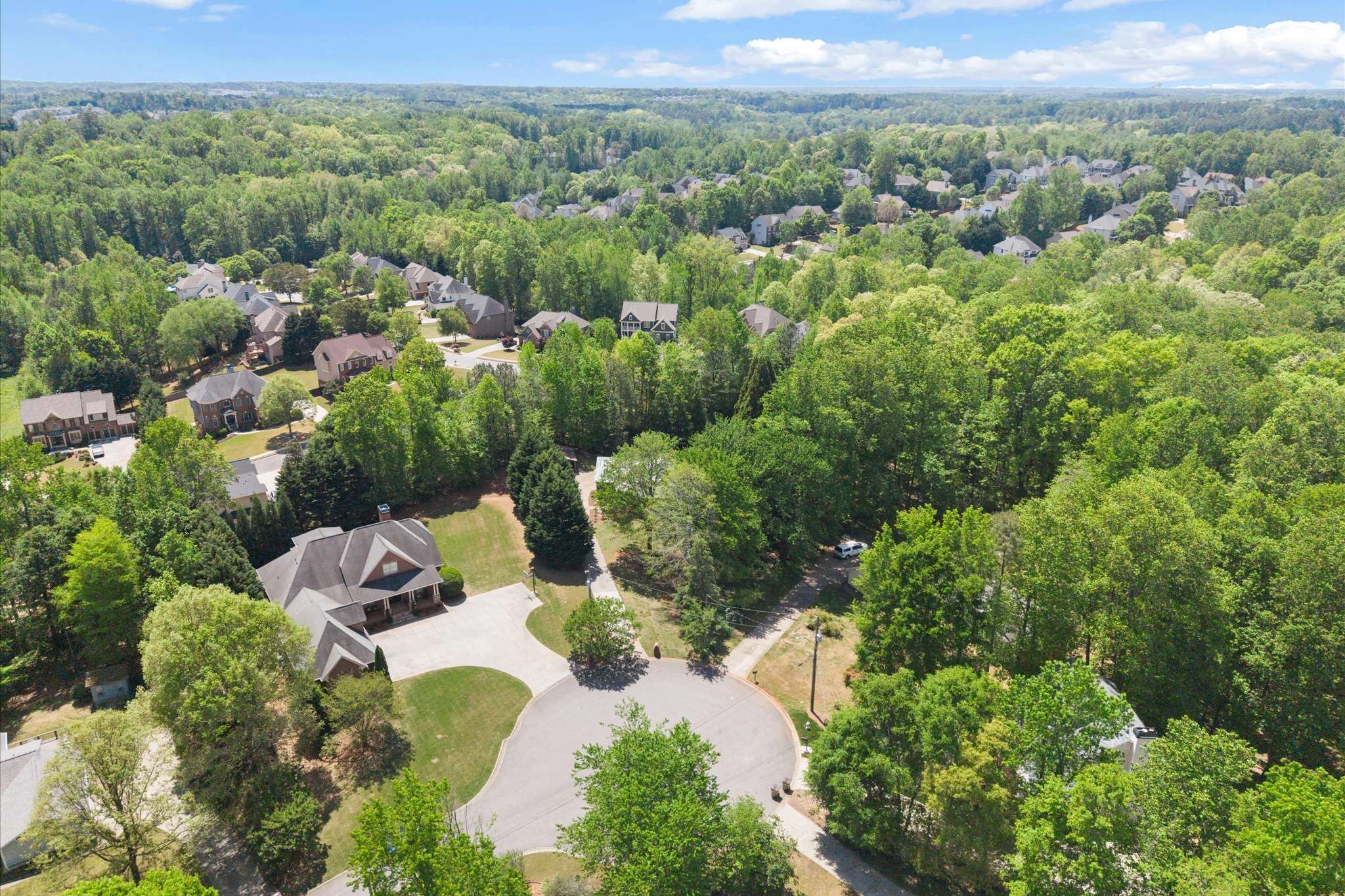 57 of 72. Discover a peaceful community surrounded by lush greenery and spacious lots, perfect for your dream home.