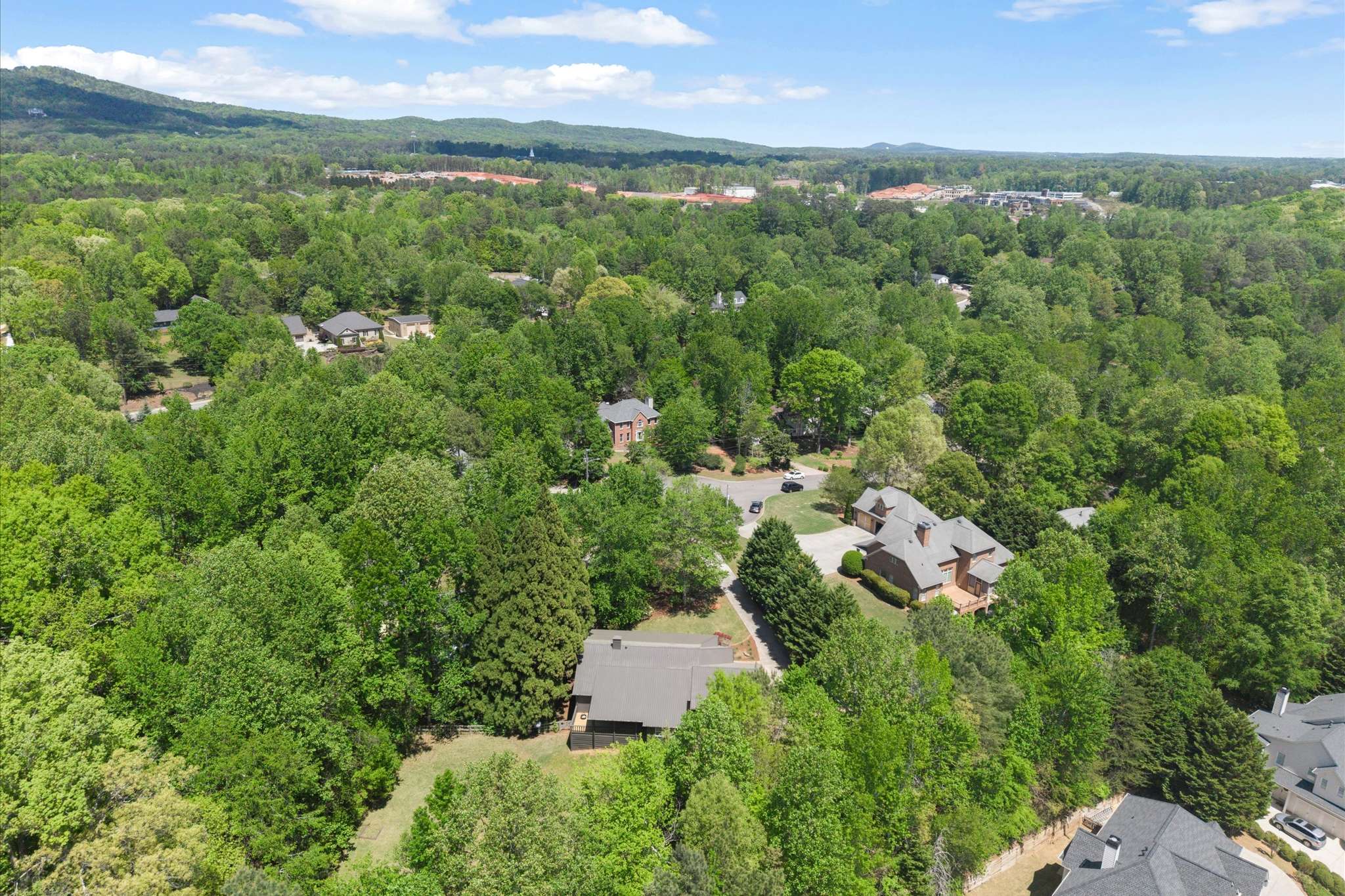 61 of 72. Discover this expansive lot nestled among lush greenery, offering a peaceful retreat in a thriving community.