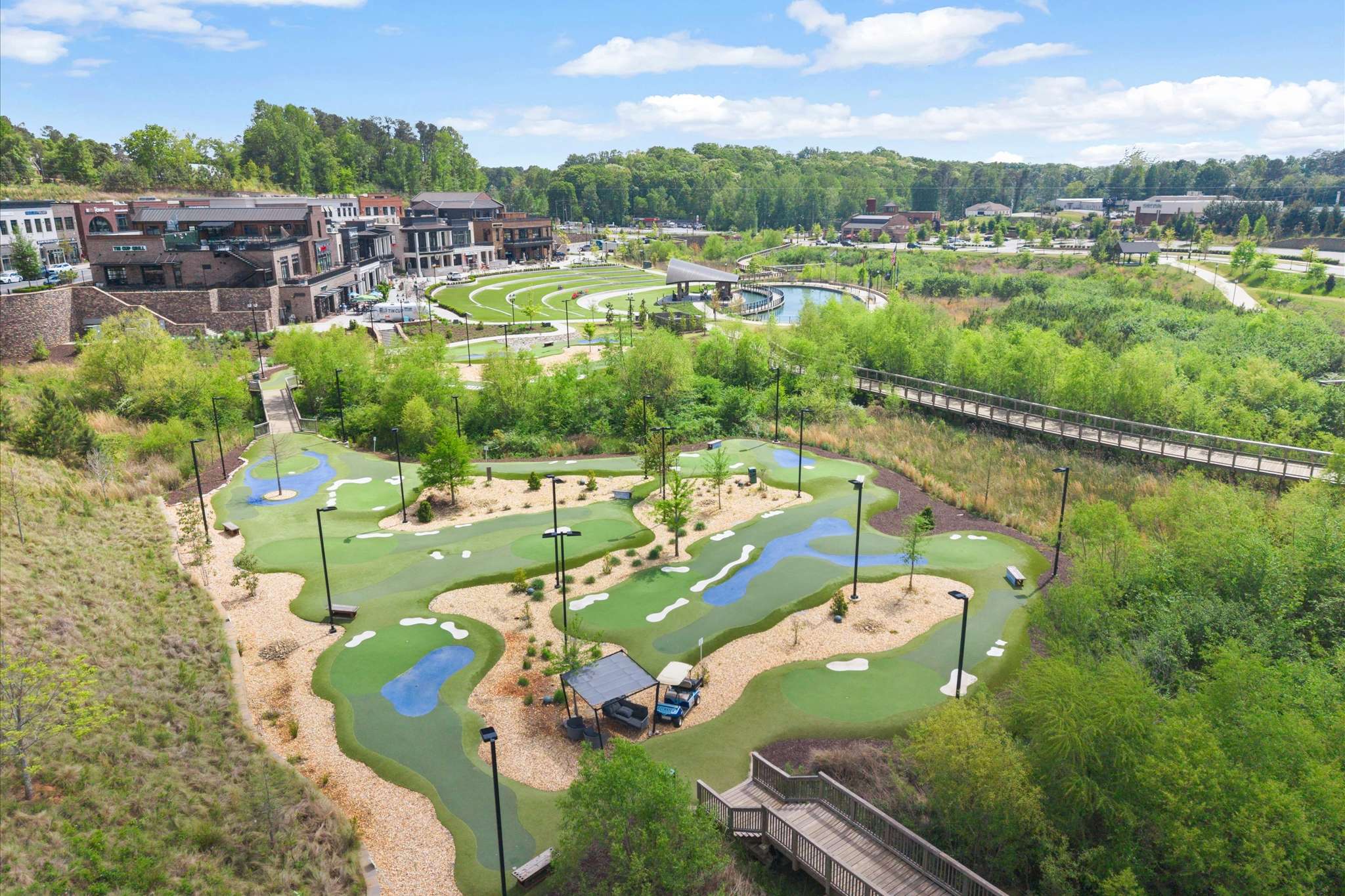 66 of 72. Discover this vibrant community featuring a unique landscape with a mini-golf course and lush greenery.