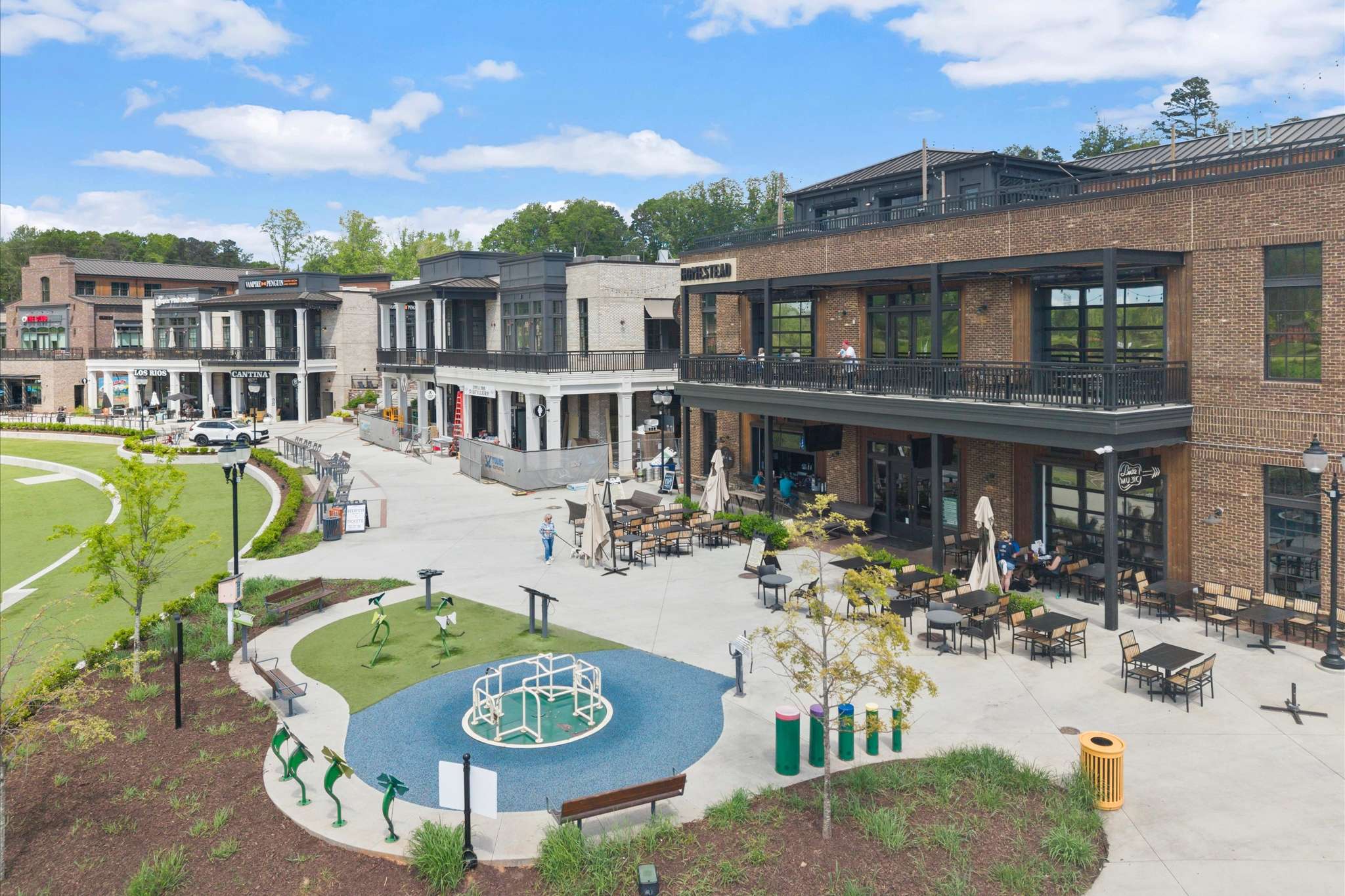 69 of 72. Vibrant commercial area featuring diverse dining options and community spaces, perfect for gatherings and leisure.