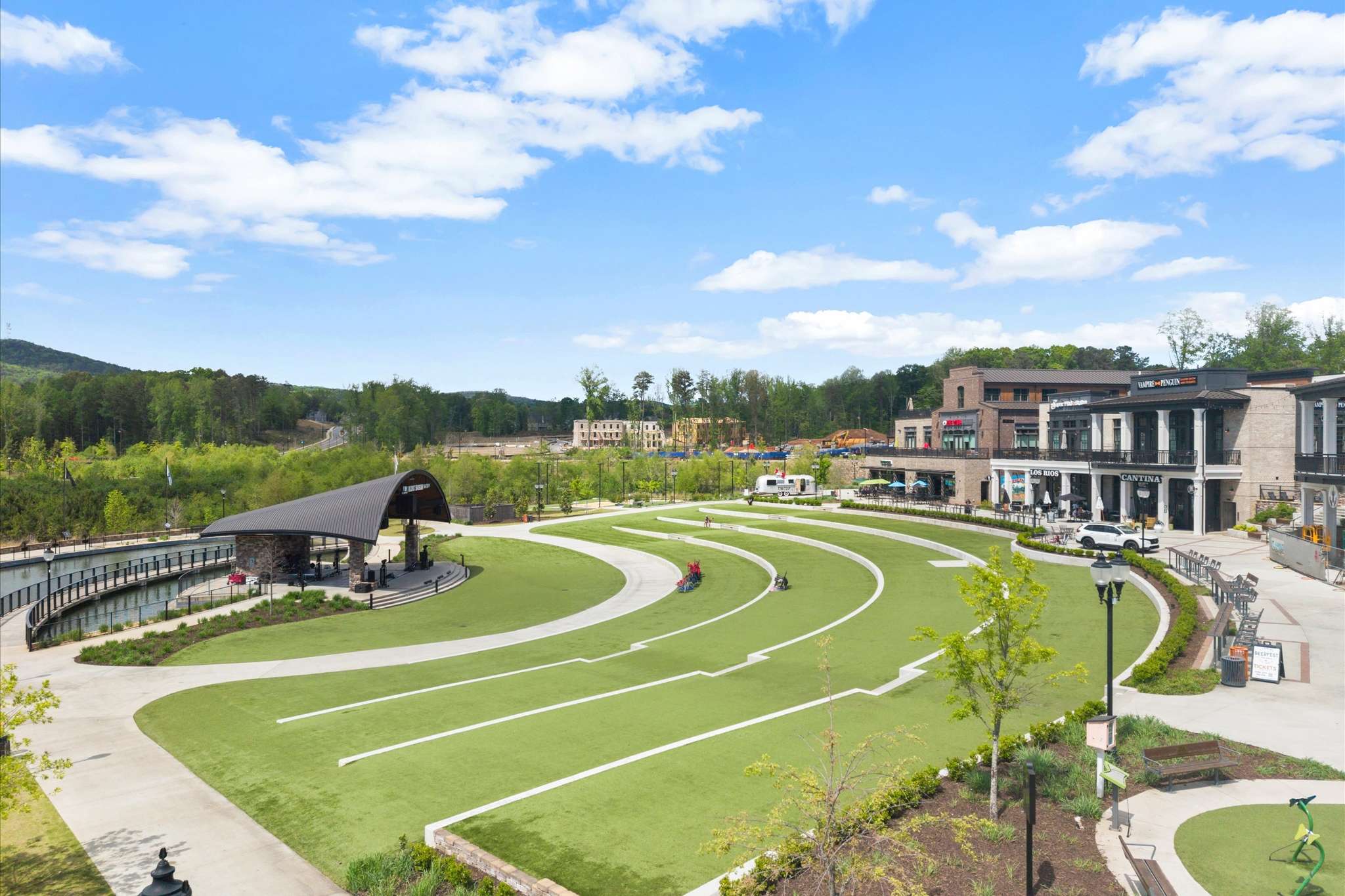 70 of 72. Expansive outdoor community space featuring a landscaped green area, perfect for gatherings and activities.