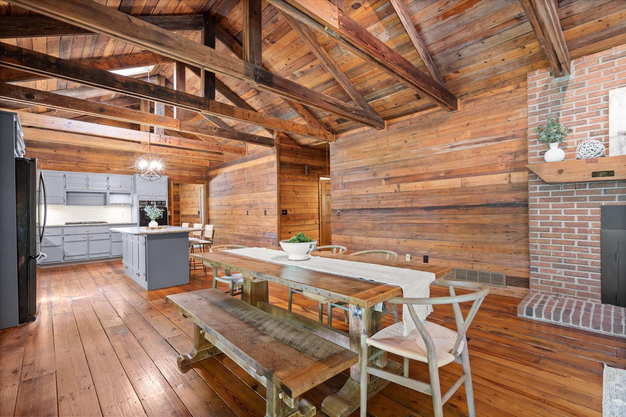 14 of 72. Spacious kitchen with exposed beams and natural wood finishes, perfect for family gatherings and entertaining.