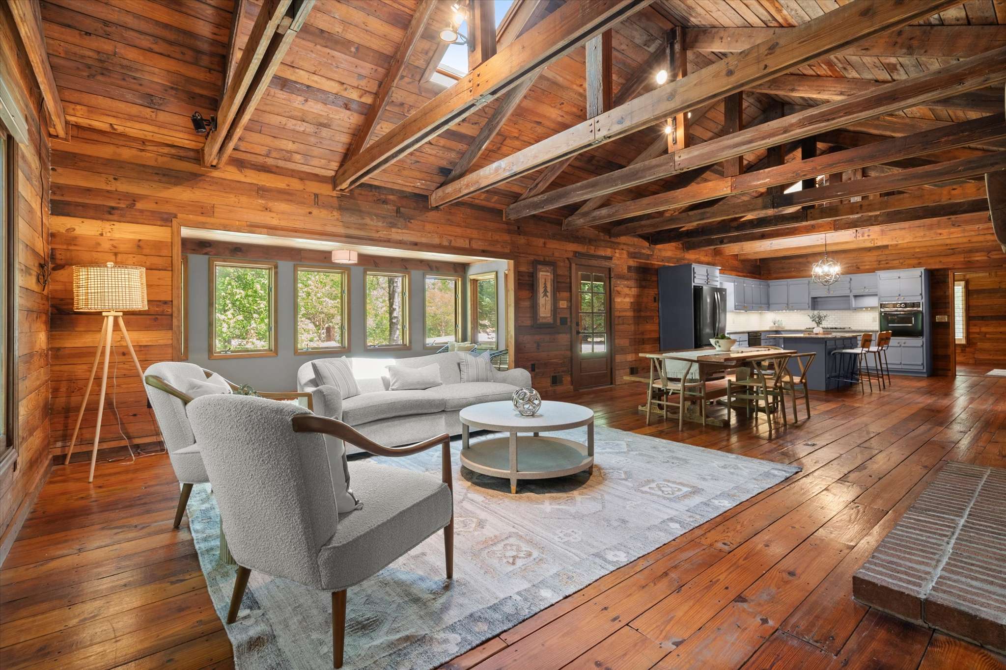 17 of 72. Experience rustic warmth in this spacious, open-concept living area with inviting natural light and stunning wood accents.