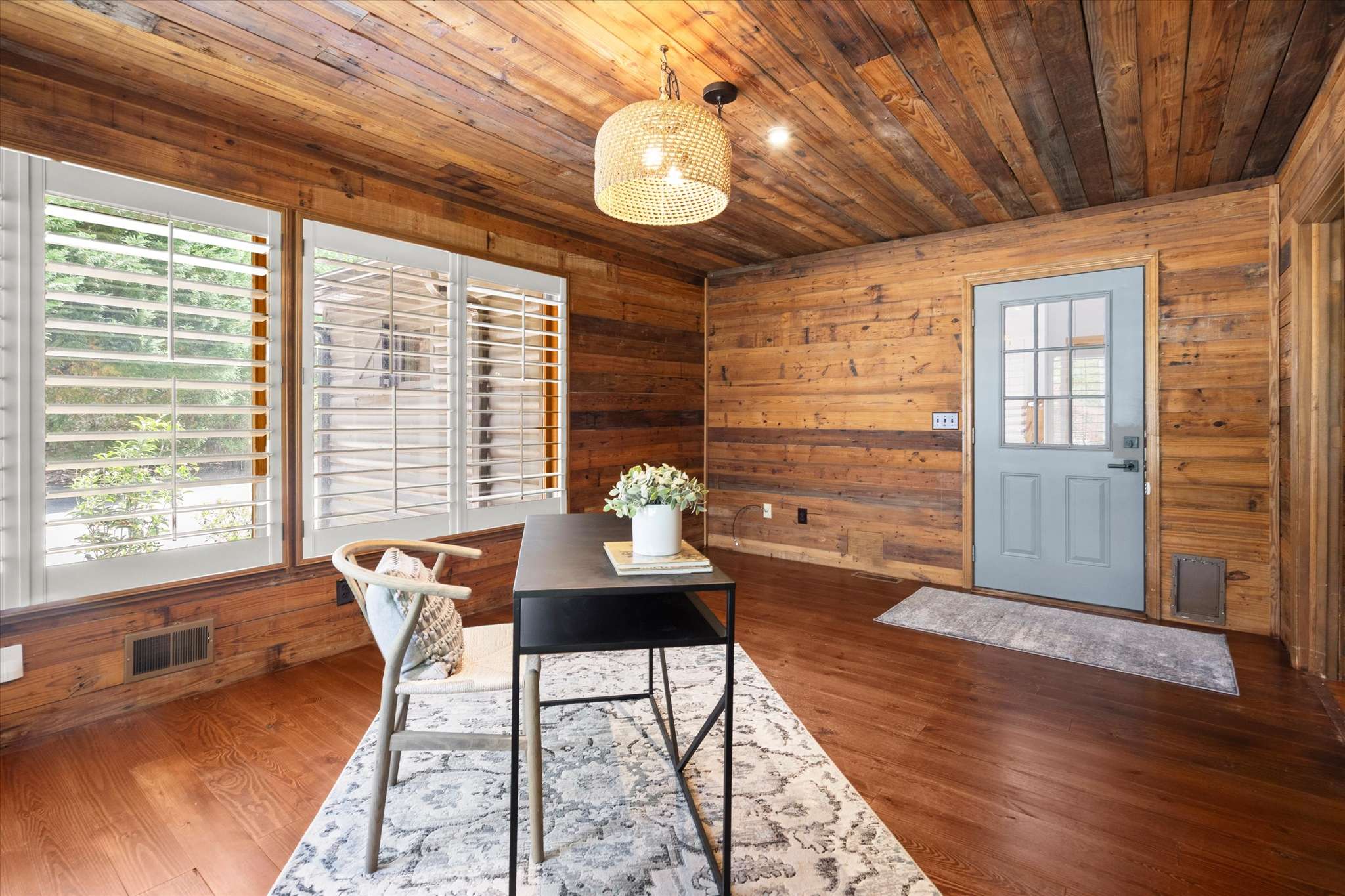 31 of 72. Bright and inviting office space featuring natural wood accents and ample natural light for productivity.