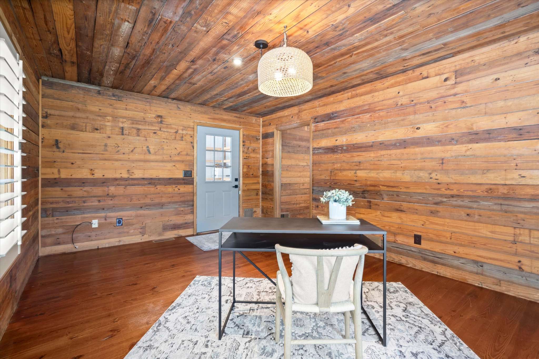 32 of 72. Bright office space featuring natural wood accents, modern lighting, and a welcoming atmosphere for productivity.