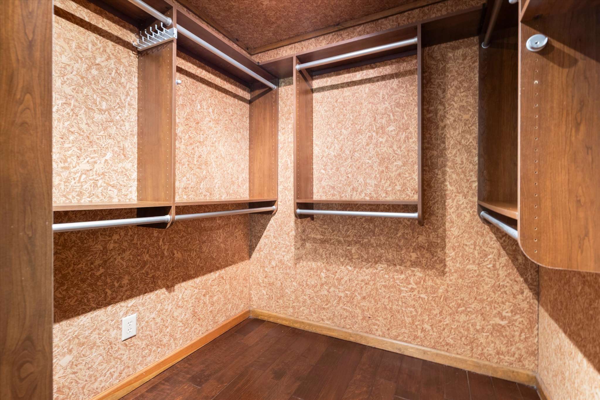 35 of 72. Expansive walk-in closet with ample shelving and storage options, perfect for organizing your wardrobe efficiently.