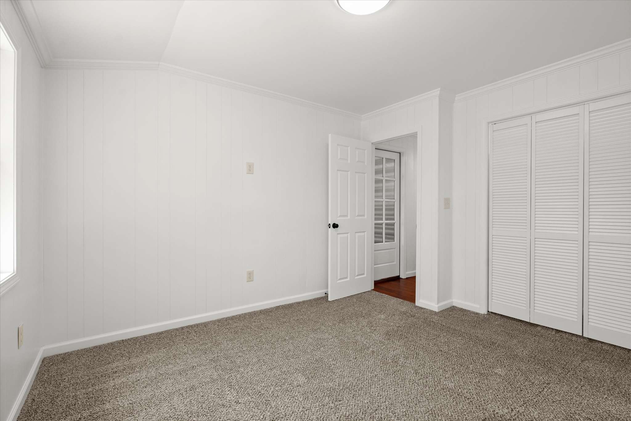 43 of 72. Spacious, well-lit room featuring neutral tones and ample storage options, perfect for your personal touch.