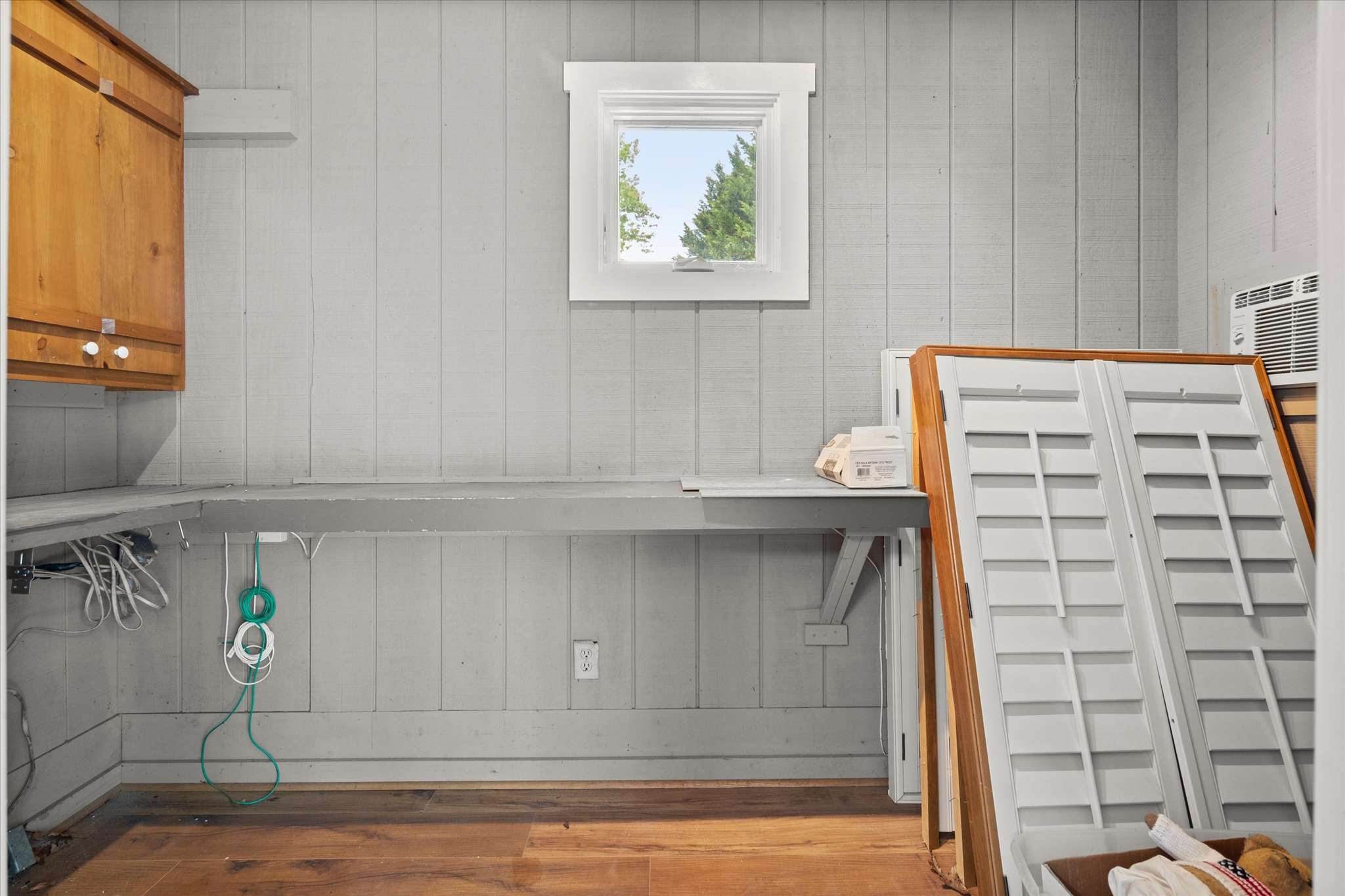 56 of 72. Spacious utility room featuring practical layout and natural light, perfect for storage and workspace needs.