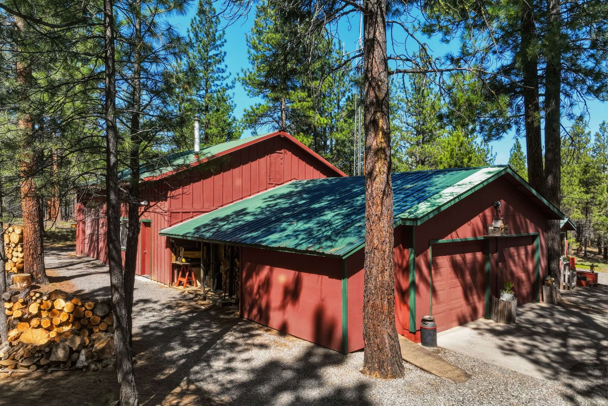 3 of 61. 30'x40' shop with a 30'x16.5' RV bay and two additional 22'x14' rooms. The 2-car oversized garage has an insulated storage area with baseboard heat. Outside is a 12'x6' shed and a 16'x6' covered wood storage area. The detached pump house/greenhouse is 12'x8'.