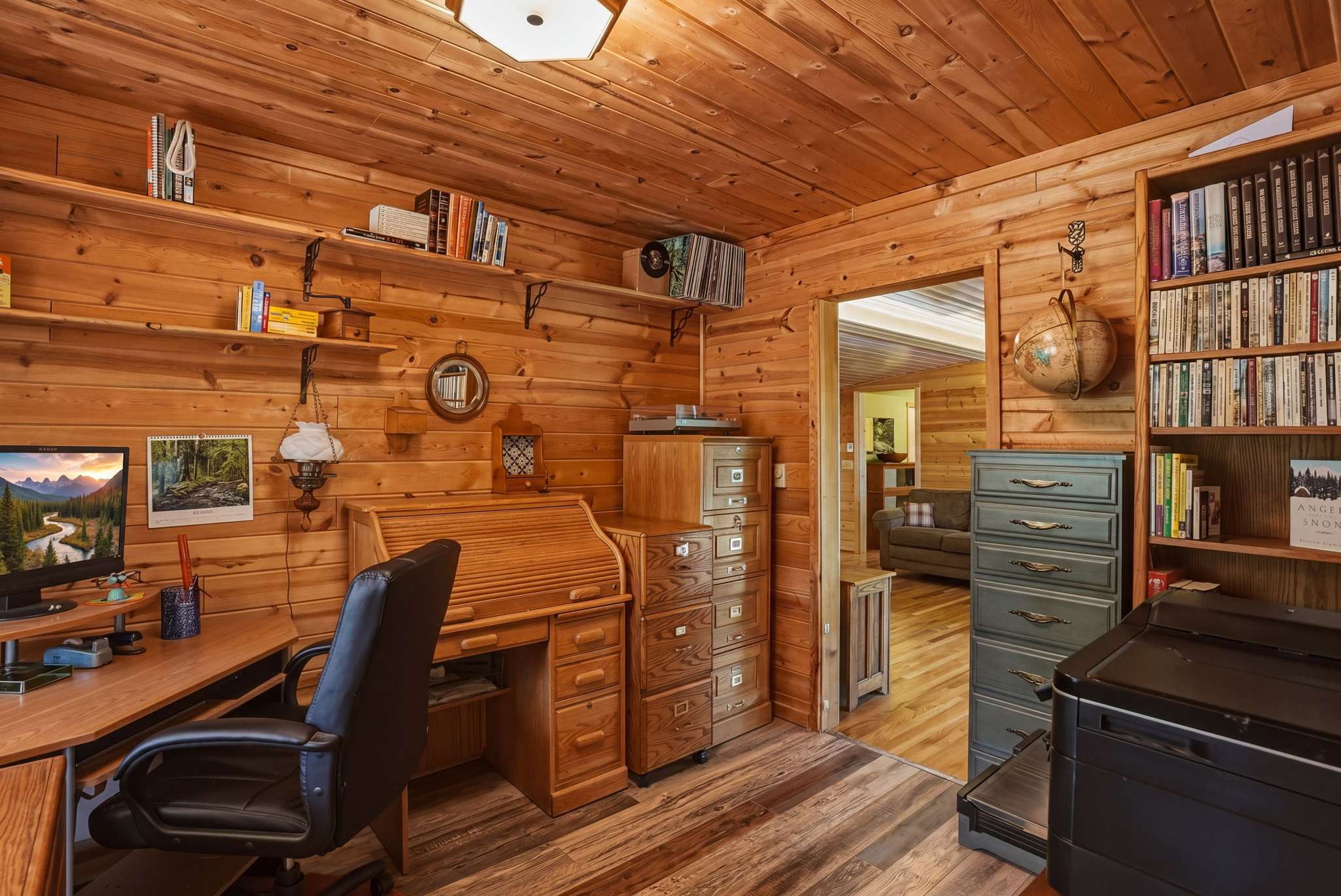 23 of 61. Cozy office space featuring ample storage, natural light, and a peaceful ambiance for productivity.