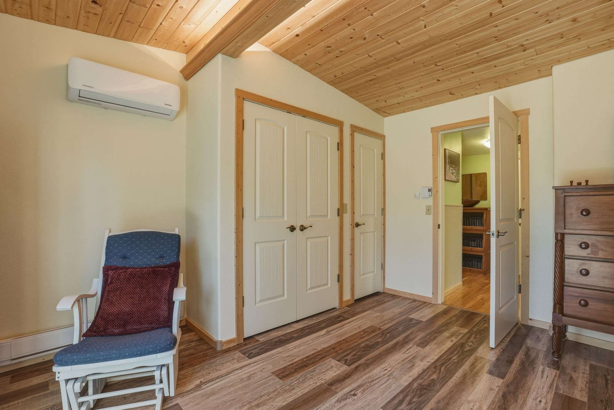28 of 61. Bright and airy room featuring wooden accents, dual closets, and convenient access to adjoining spaces.