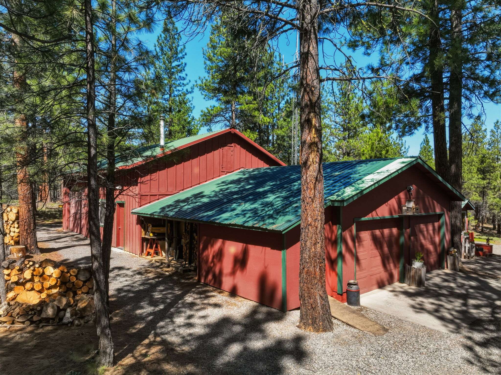 3 of 61. 30'x40' shop with a 30'x16.5' RV bay and two additional 22'x14' rooms. The 2-car oversized garage has an insulated storage area with baseboard heat. Outside is a 12'x6' shed and a 16'x6' covered wood storage area. The detached pump house/greenhouse is 12'x8'.