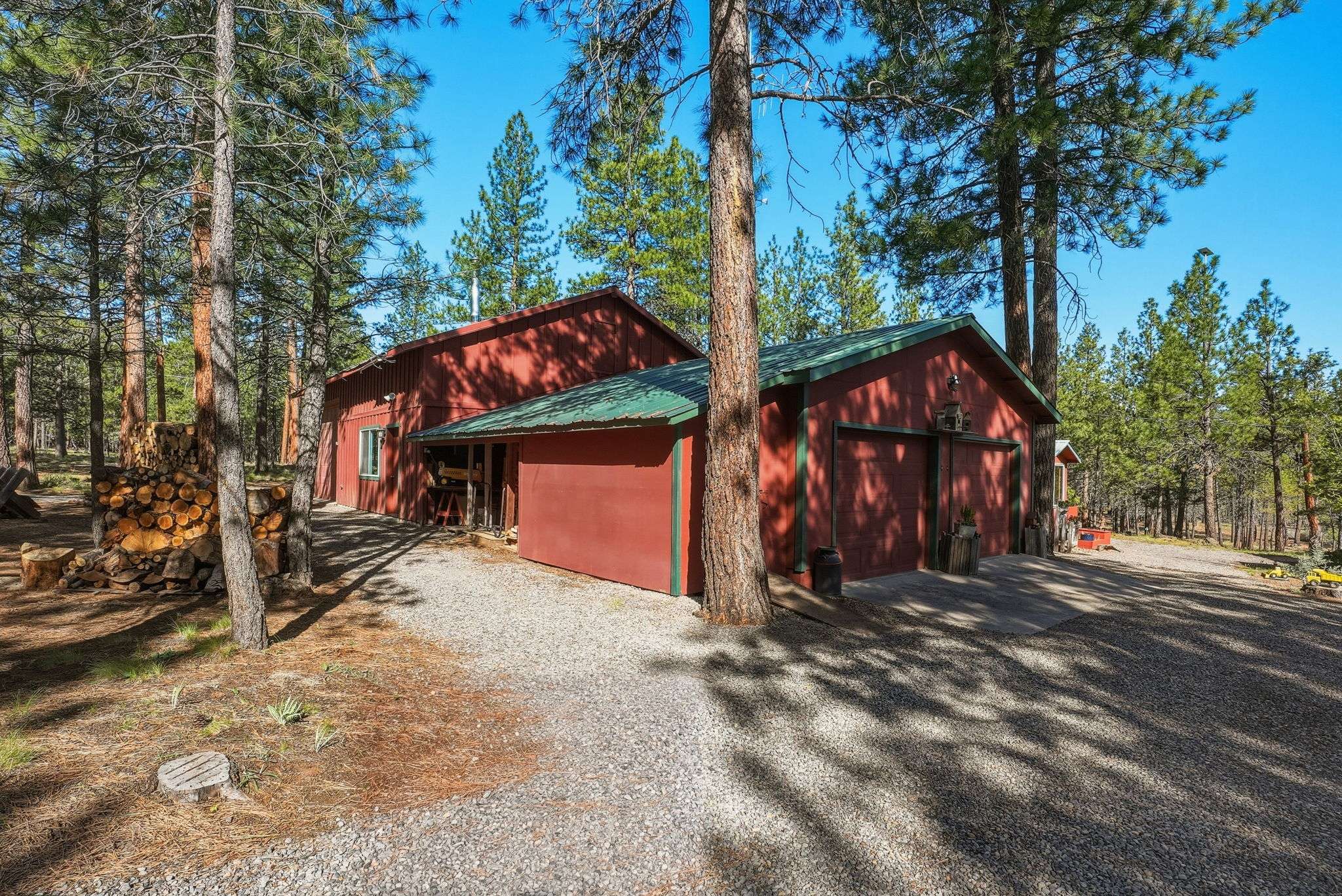 45 of 61. 28'x30' shop with 28'x16' RV bay and two additional 22'x14' finished, insulated flex/clean rooms -- perfect for a home office, game room, fitness studio, craft space, or more! The 2-car oversized garage has heated storage, dedicated wood storage, and a storage room. Plus exterior shed and wood storage.