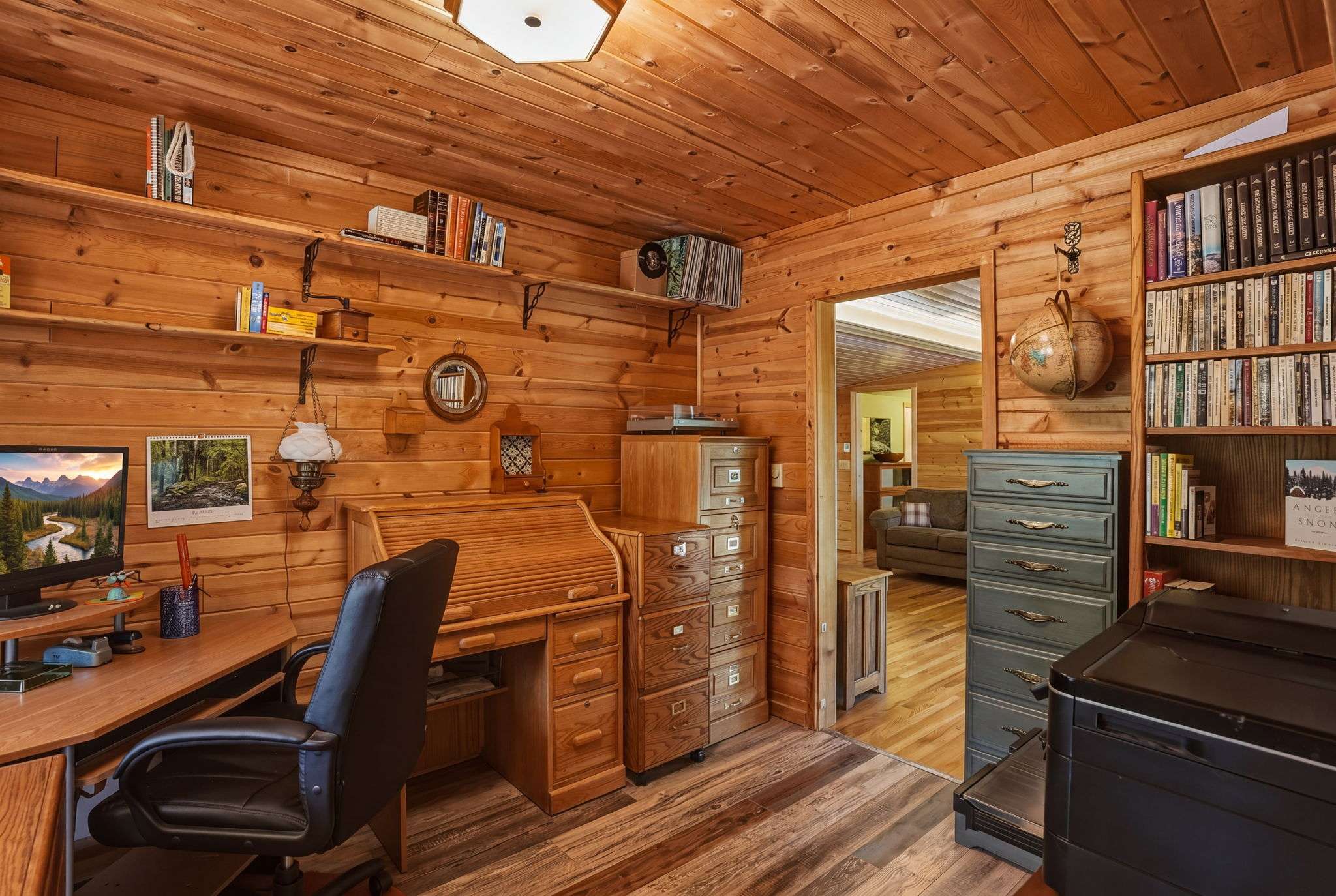 23 of 61. Cozy office space featuring ample storage, natural light, and a peaceful ambiance for productivity.