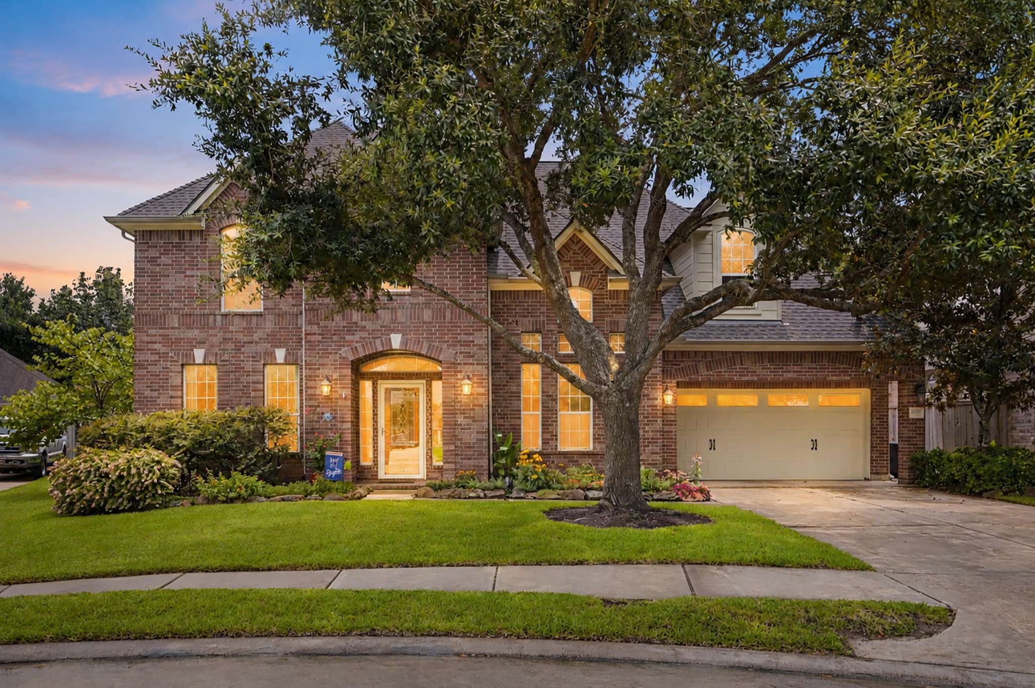 1 of 71. Stunning two-story brick home featuring spacious interiors and lush landscaping, perfect for family living.