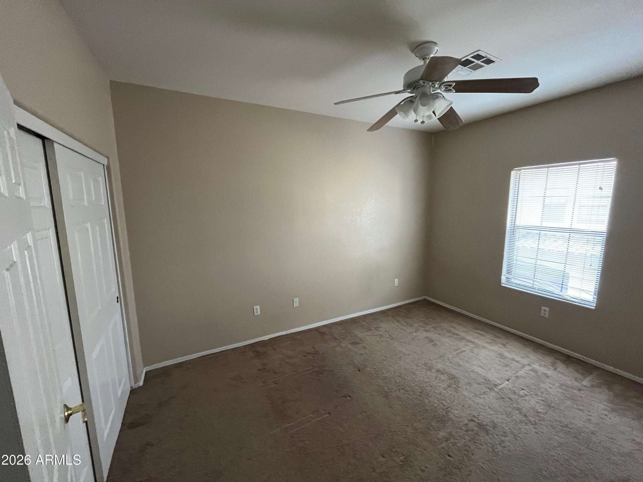 25 of 26. This inviting bedroom features soft carpeting, natural light, ceiling fan, and a roomy closet, providing comfortable accommodations and versatile functionality within the home.