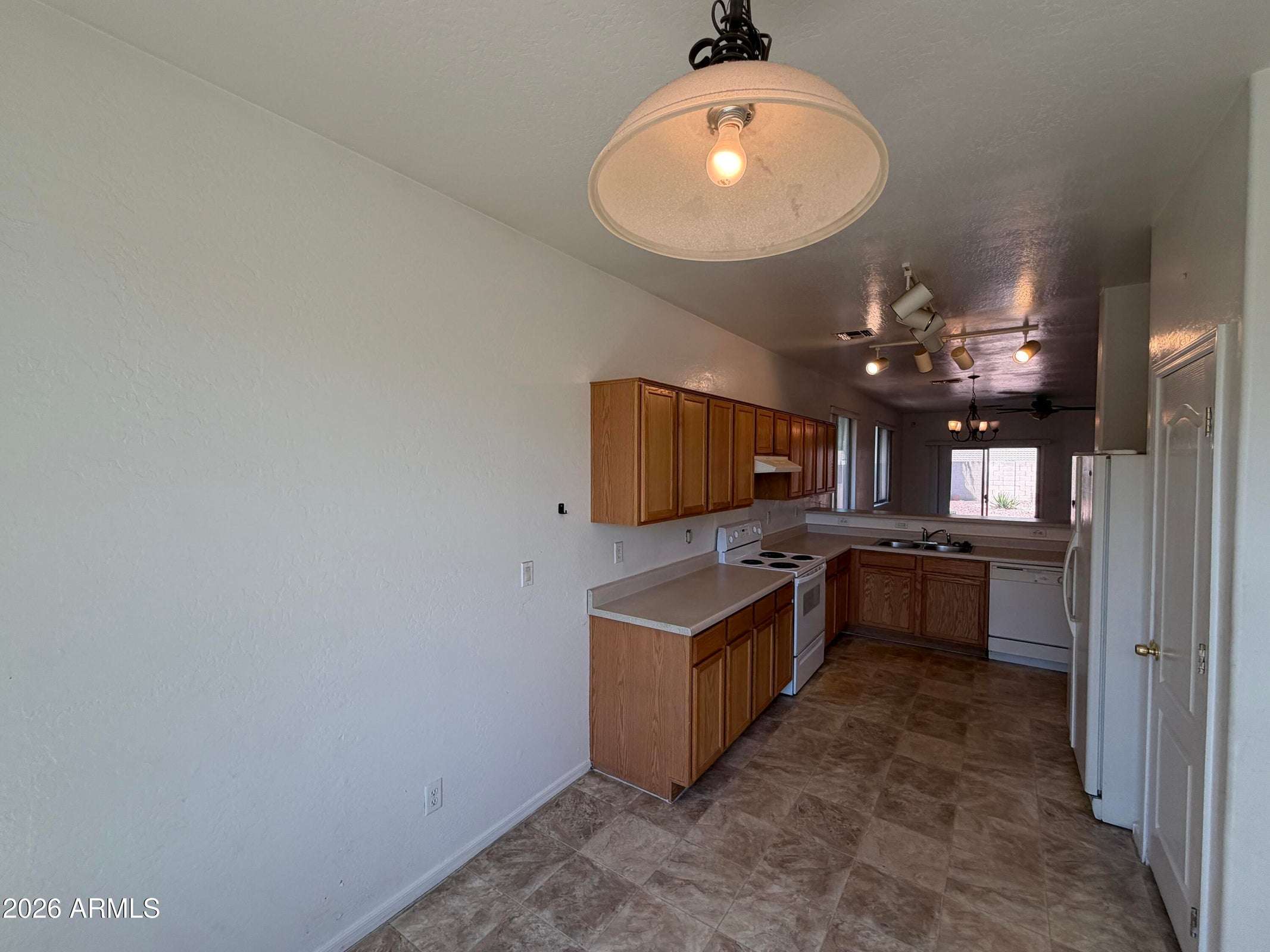 9 of 31. Bright dining area adjacent to the kitchen provides a welcoming place for everyday meals. Large windows bring in natural light while enhancing the home's open feel.