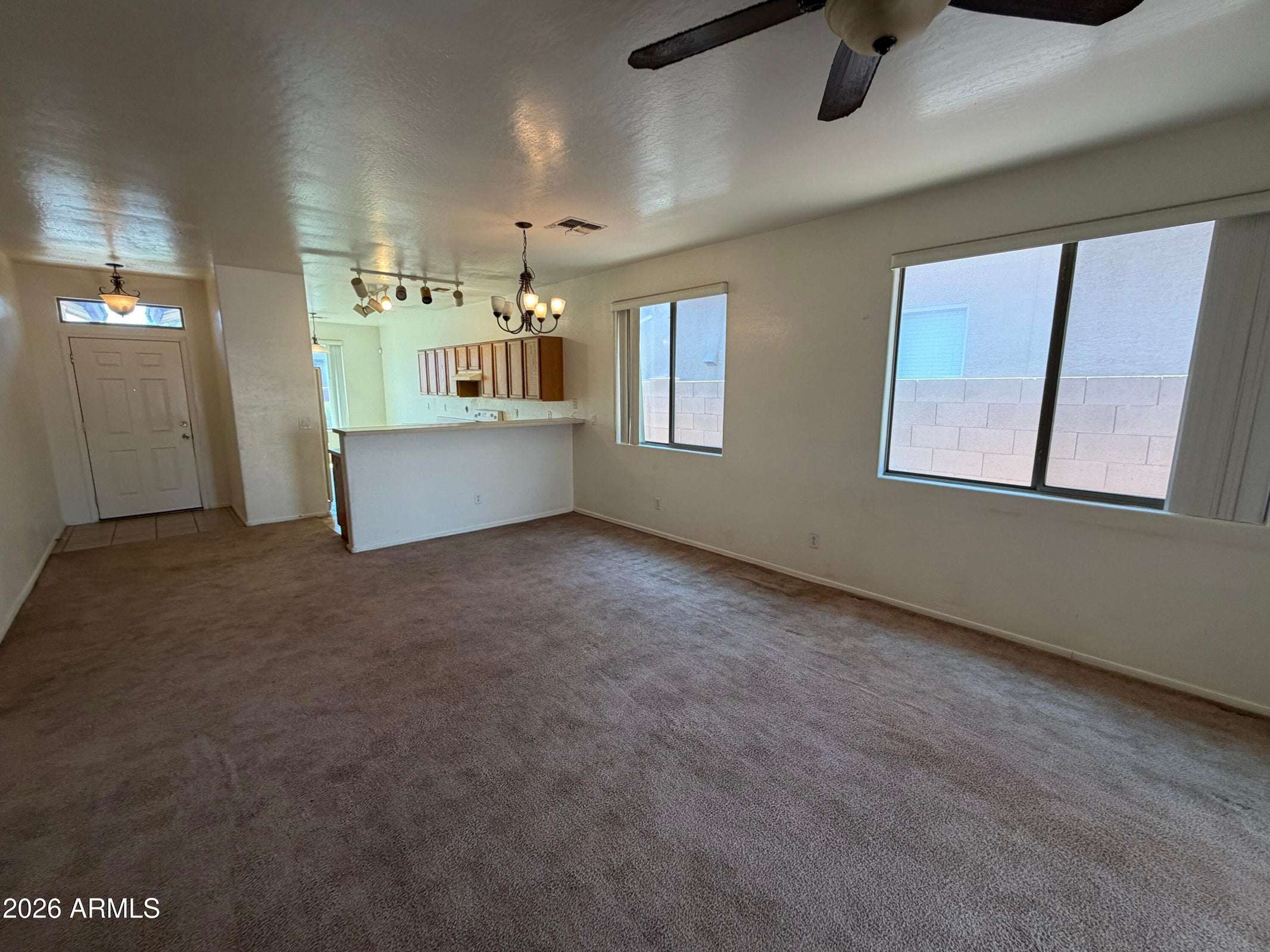12 of 31. Open-concept great room with oversized windows, abundant natural light, and an easy flow into the kitchen. A welcoming space for gathering with family and friends.