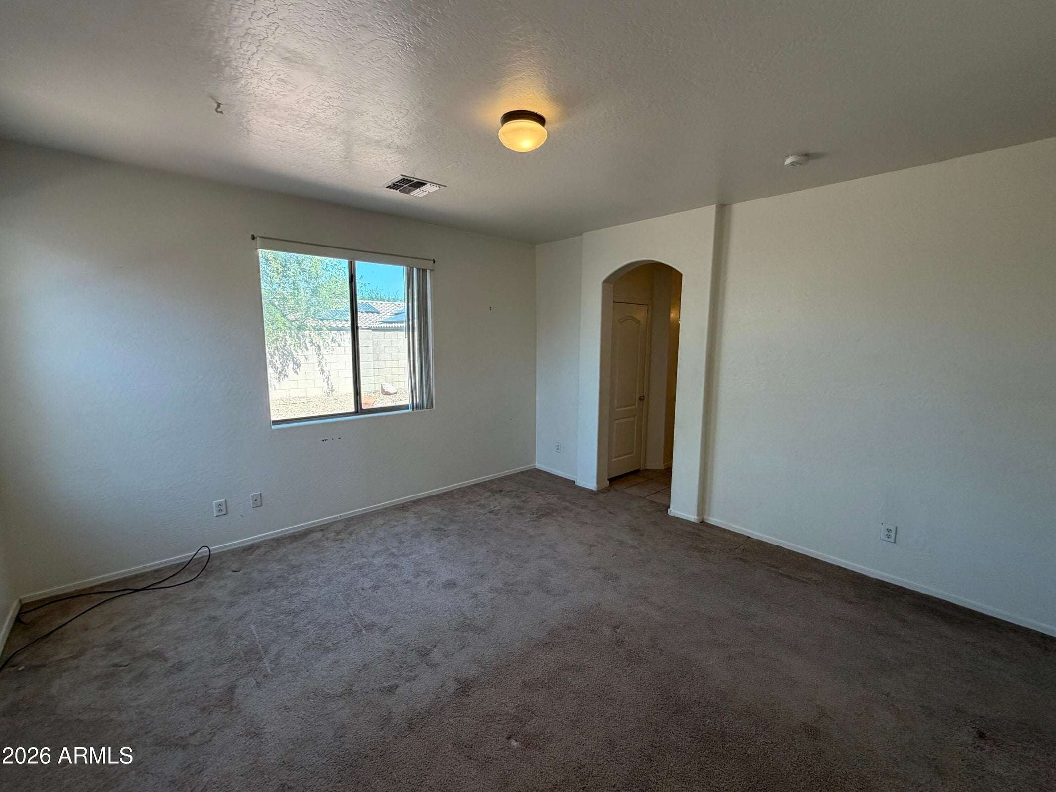 18 of 31. Well-sized bedroom featuring abundant natural light, plush carpeting, and a functional layout that easily accommodates a variety of furniture styles.