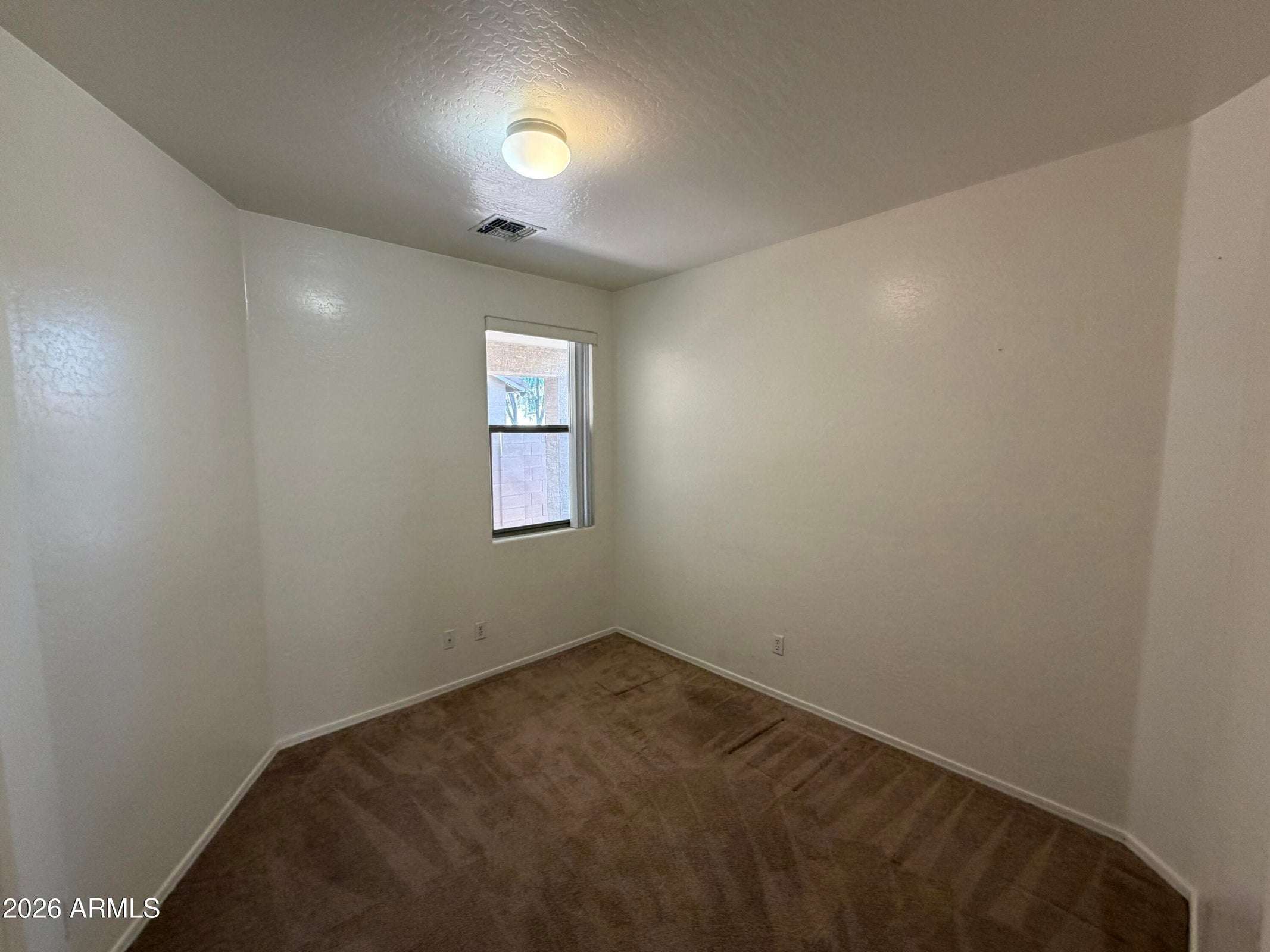 22 of 31. Versatile bonus room with plush carpeting and natural light, ideal for a home office, study, fitness room, or creative workspace.