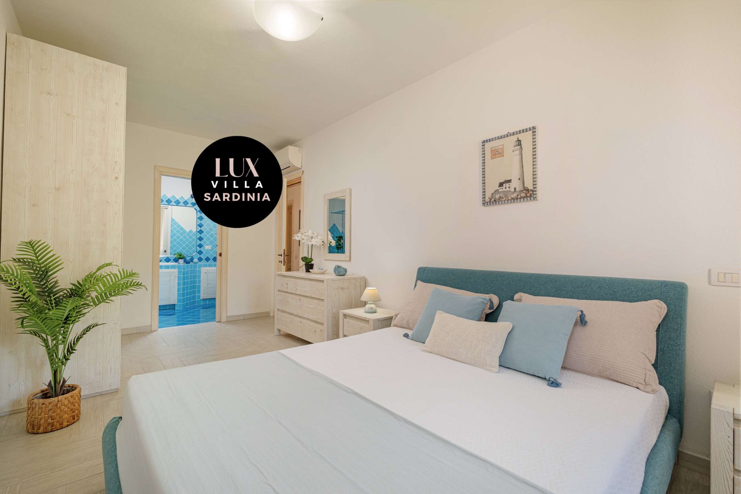 29 of 66. Bright and airy bedroom with modern furnishings, featuring a balcony and convenient storage options.