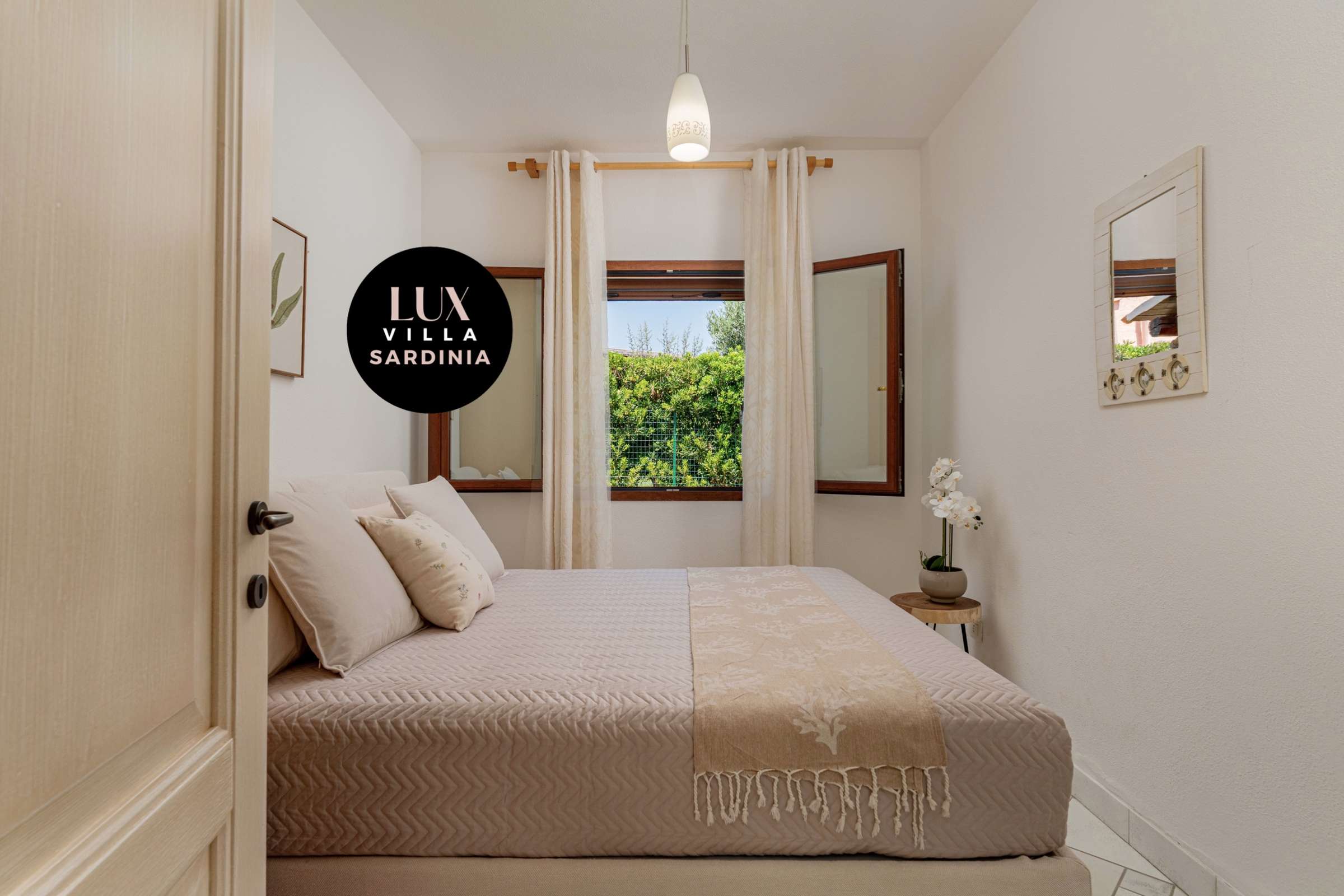 39 of 66. Cozy bedroom featuring natural light, modern decor, and tranquil views of surrounding greenery.