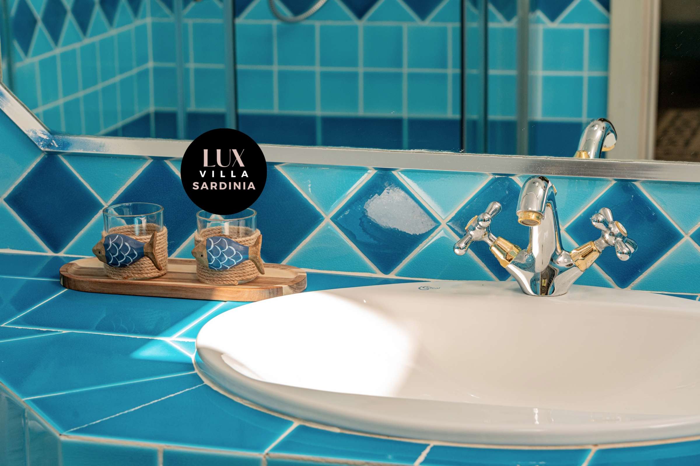 60 of 66. This vibrant bathroom features striking blue tiles and a practical layout, perfect for modern living.