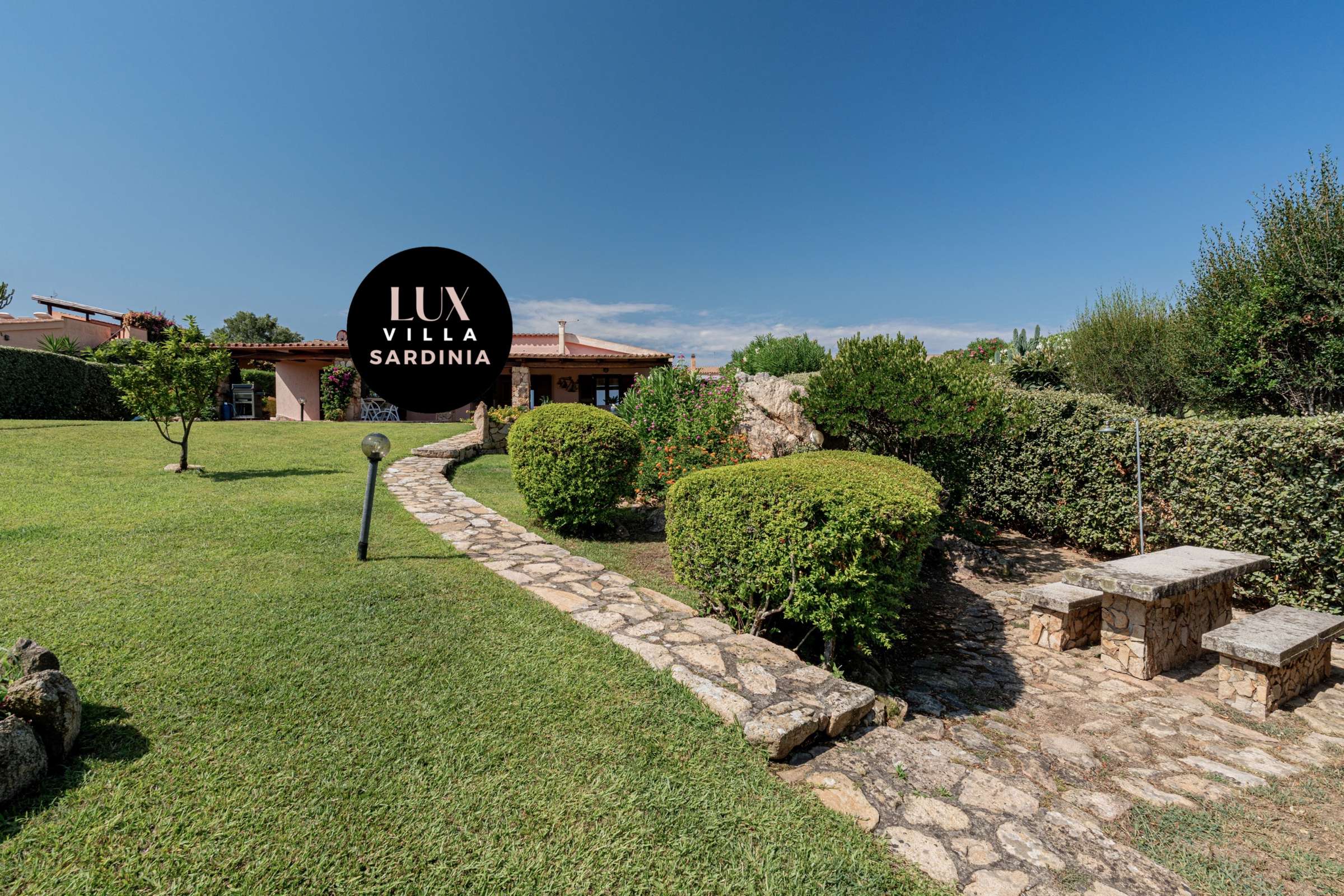 6 of 66. Lush gardens surround this inviting villa, featuring spacious outdoor areas and stunning views of the landscape.